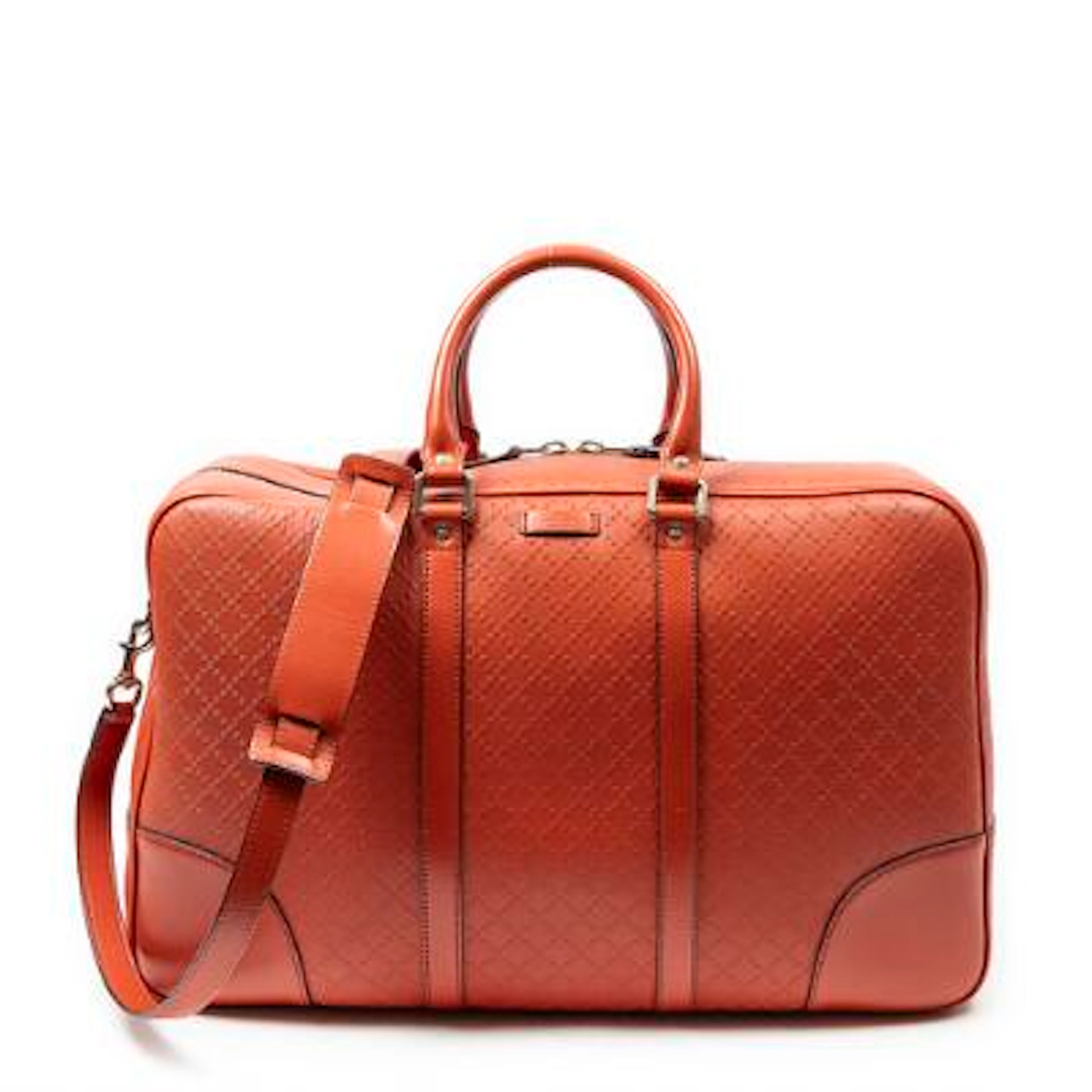 Gucci: A "Bright Duffle Bag" of red leather withsilver-tone hardware.