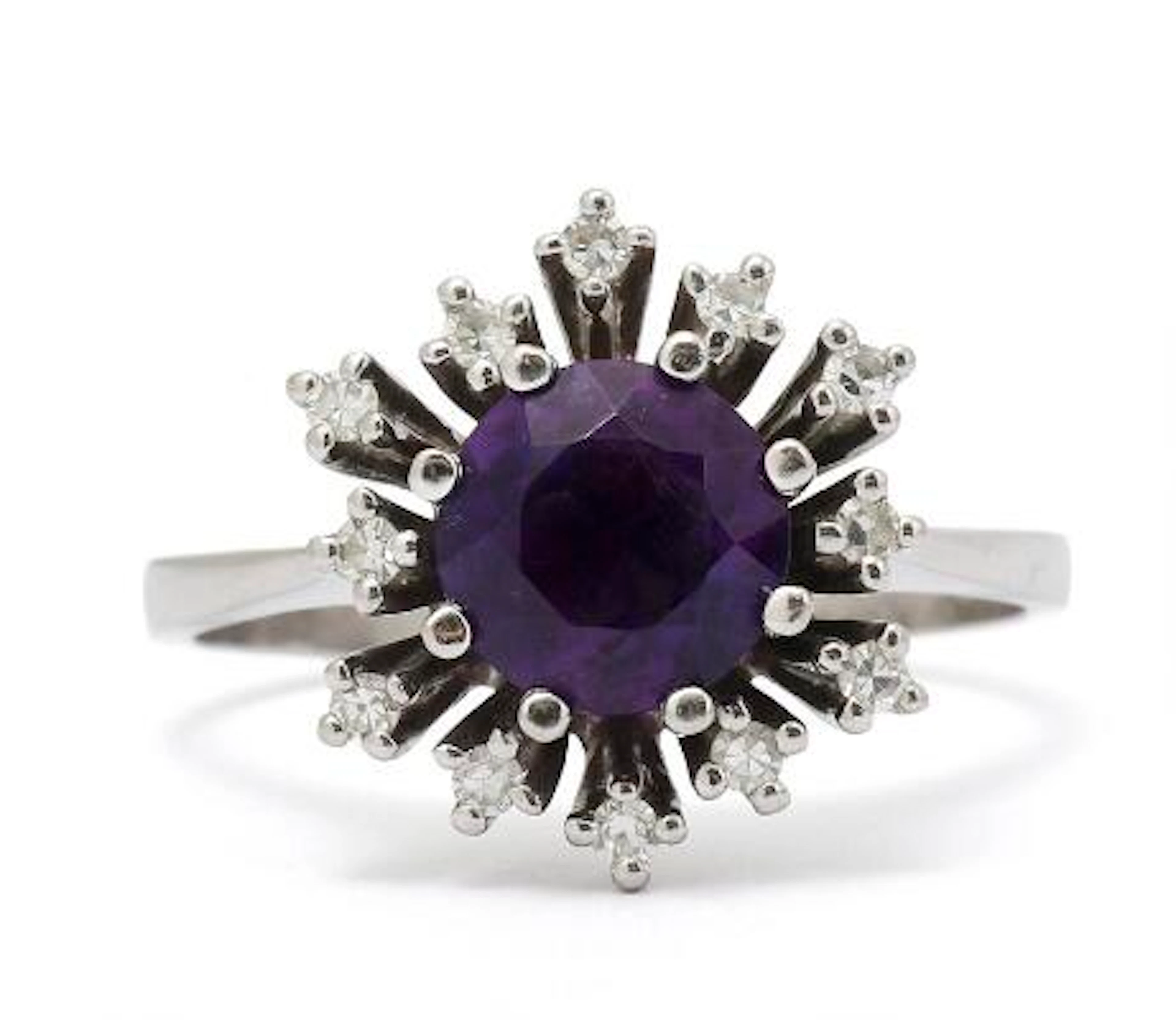 An amethyst and diamond ring set with amethyst and diamonds, mounted