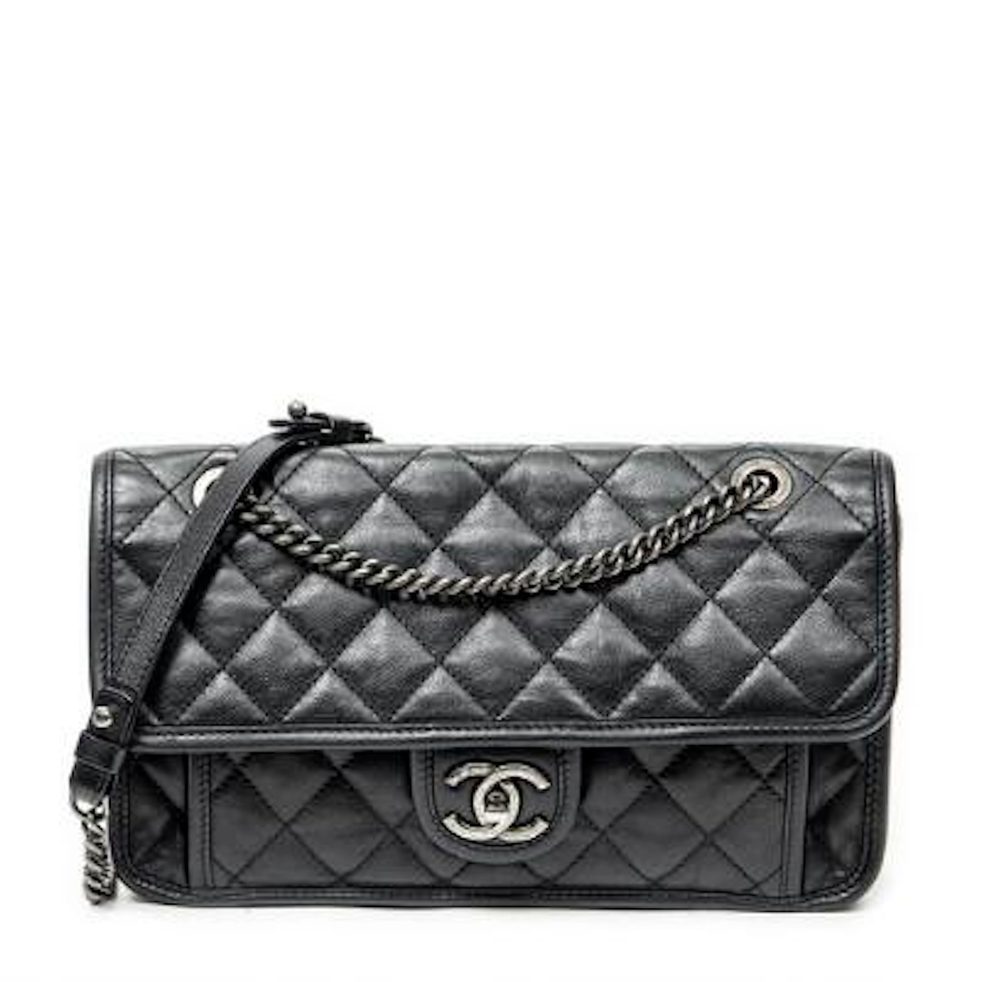 Chanel: A "French Riviera Flap" bag of black leather with silver-toned
