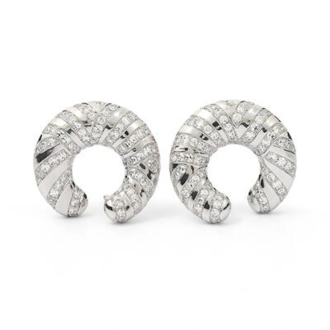 A pair of ear studs set with numerous diamonds mounted in 18k white