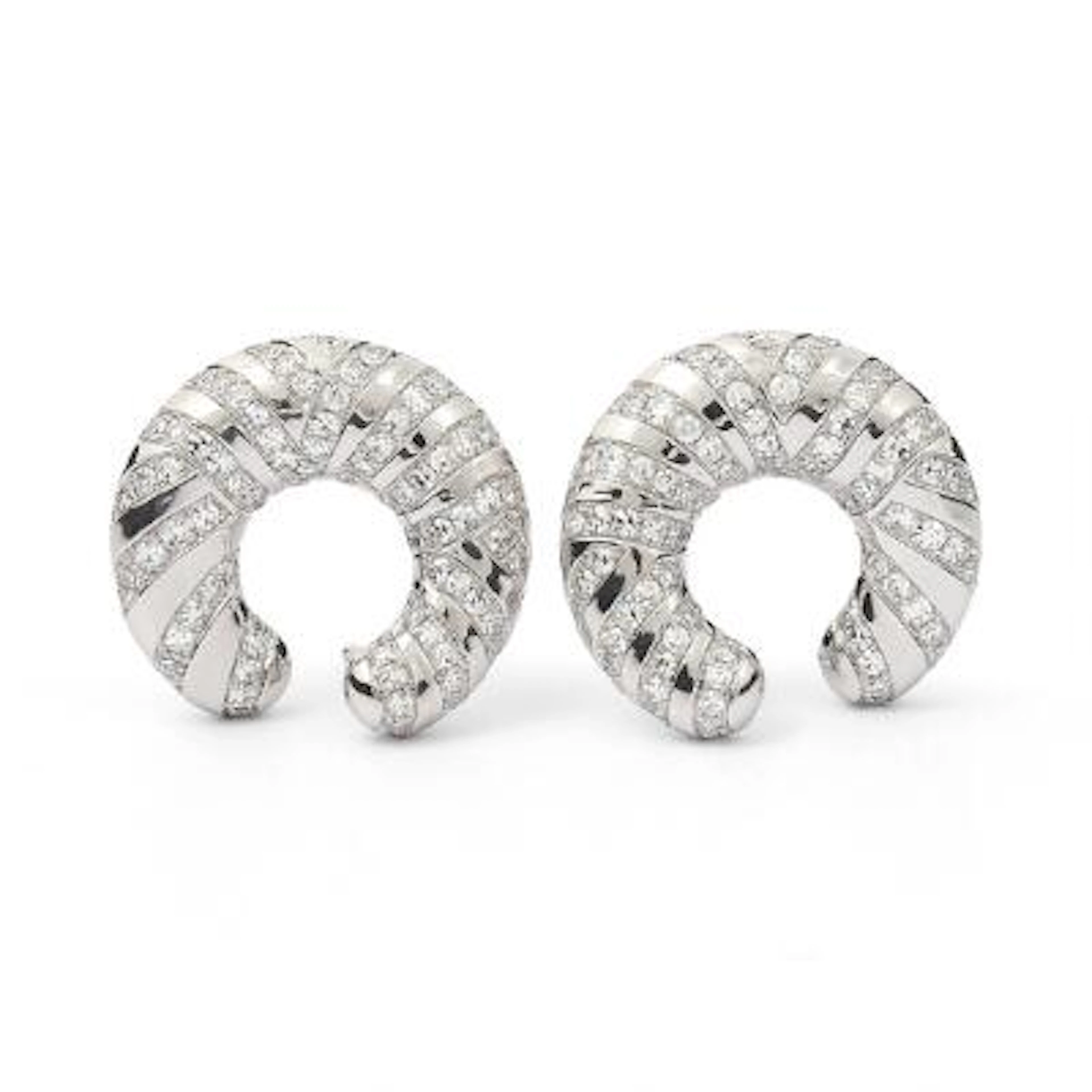 A pair of ear studs set with numerous diamonds mounted in 18k white