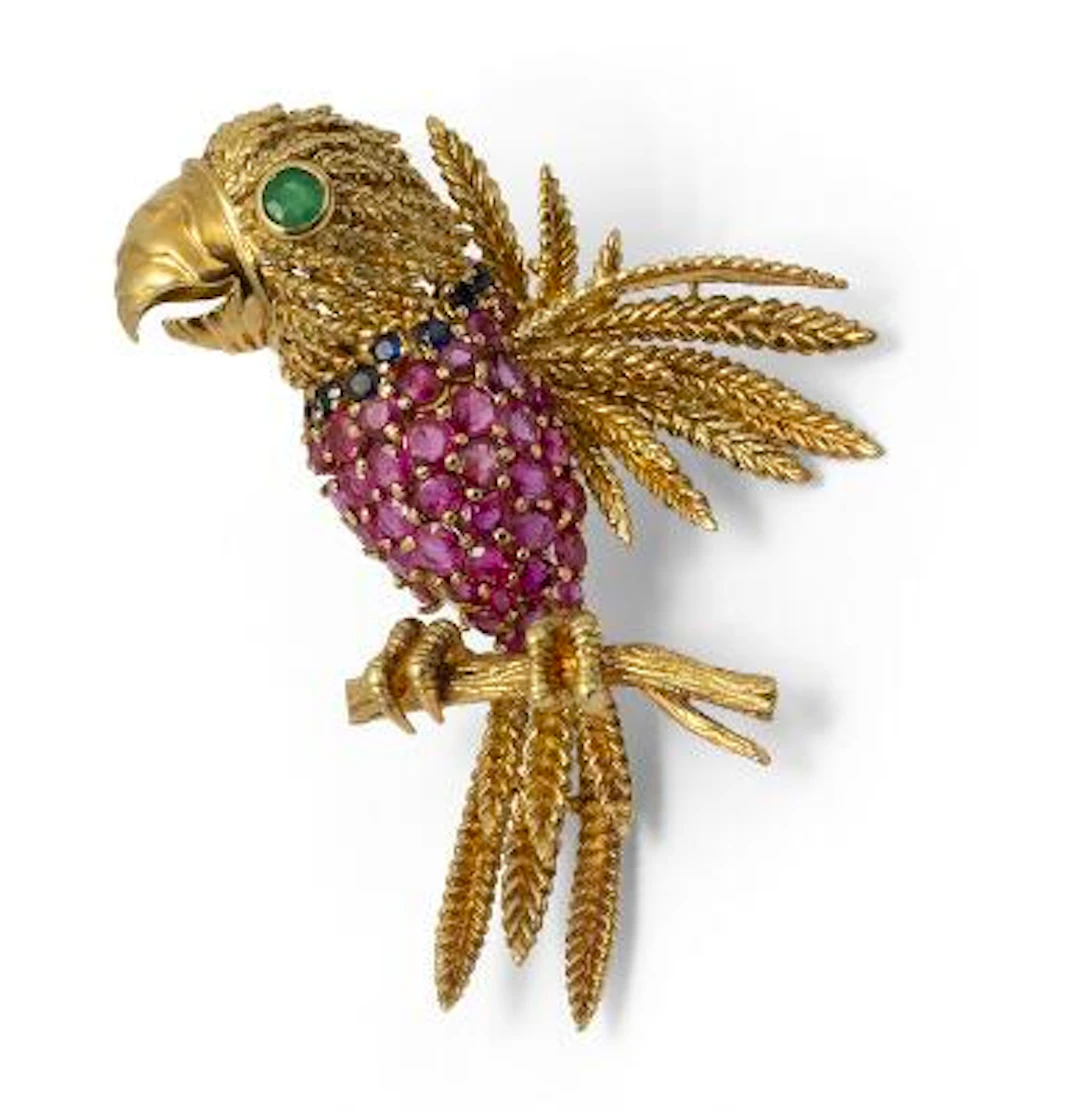 A ruby, emerald and sapphire brooch of 18k gold in the shape of a
