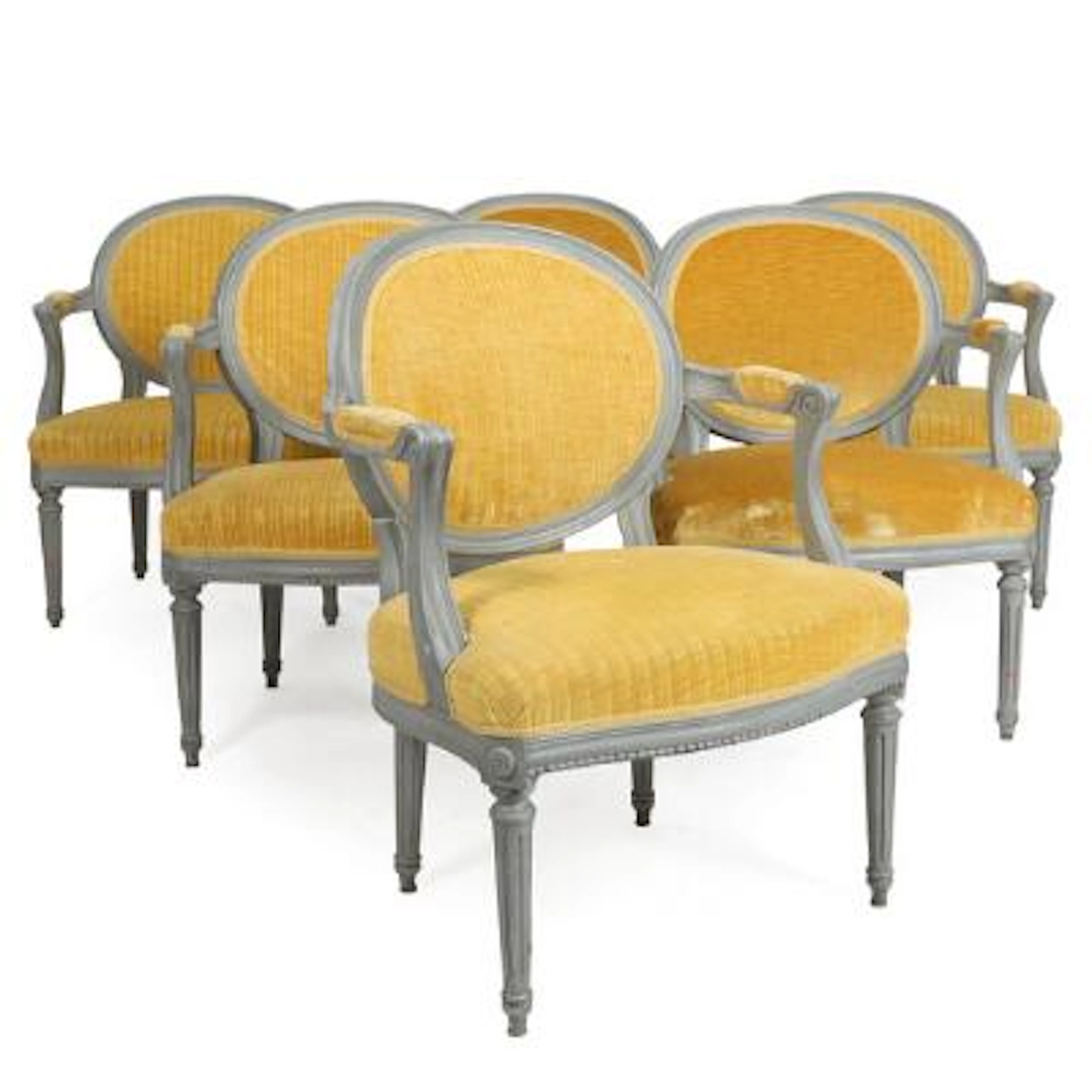 A set of six 19th century Louis XVI style gray painted wood armchairs.