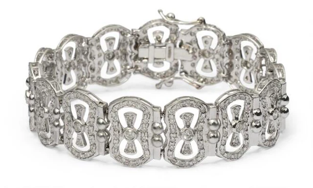 A diamond bracelet set with numerous diamonds, mounted in 14k white