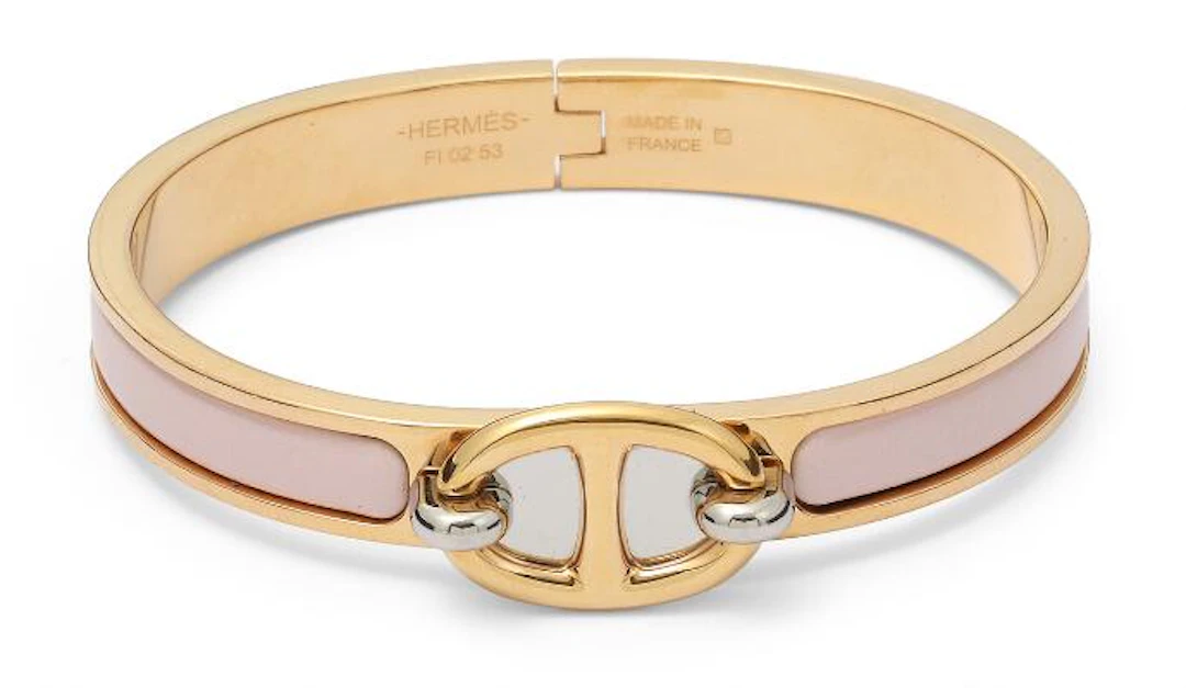 Hermès: A "Mini Clic Chaine d'Ancre" bangle of gold and silver tone