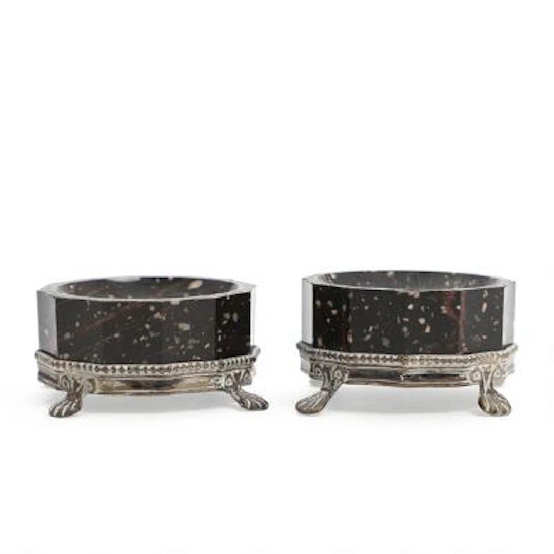A pair of angular porphyry salt cellars with Swedish silver mounts.