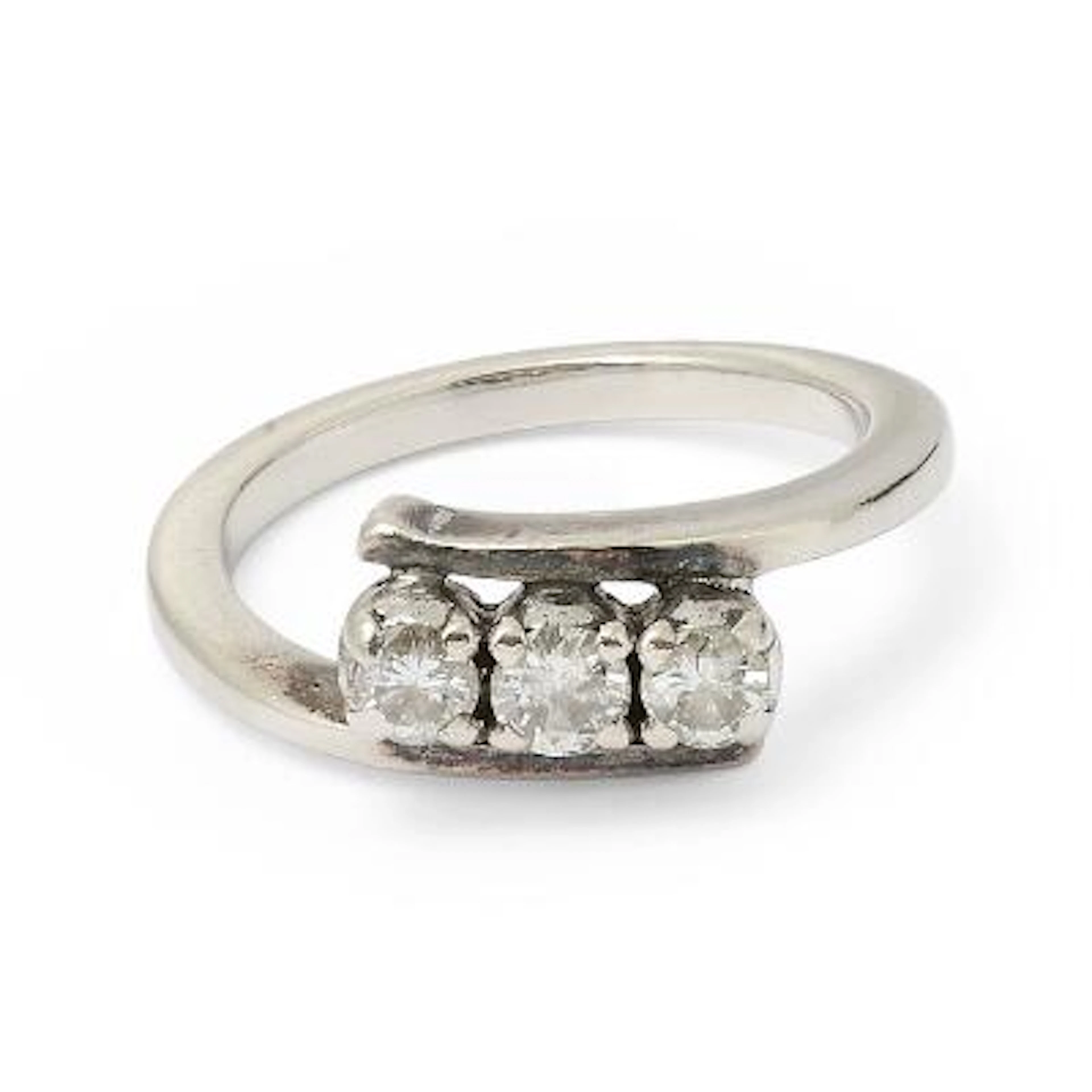 A diamond ring set with three brilliant-cut diamonds, mounted in silver.