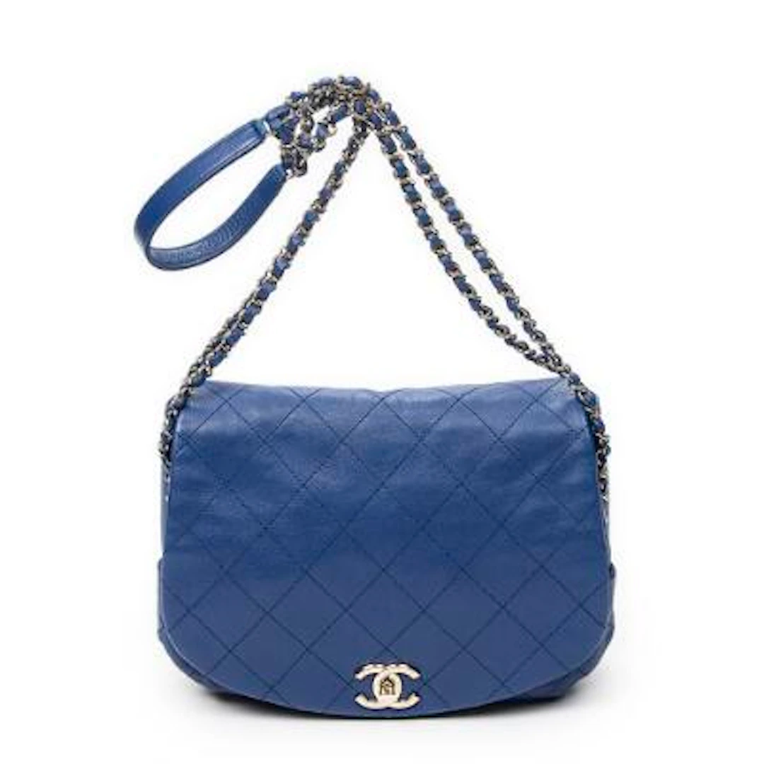 Chanel: A "Chain Around Saddle Flap" bag in blue quilted leather with