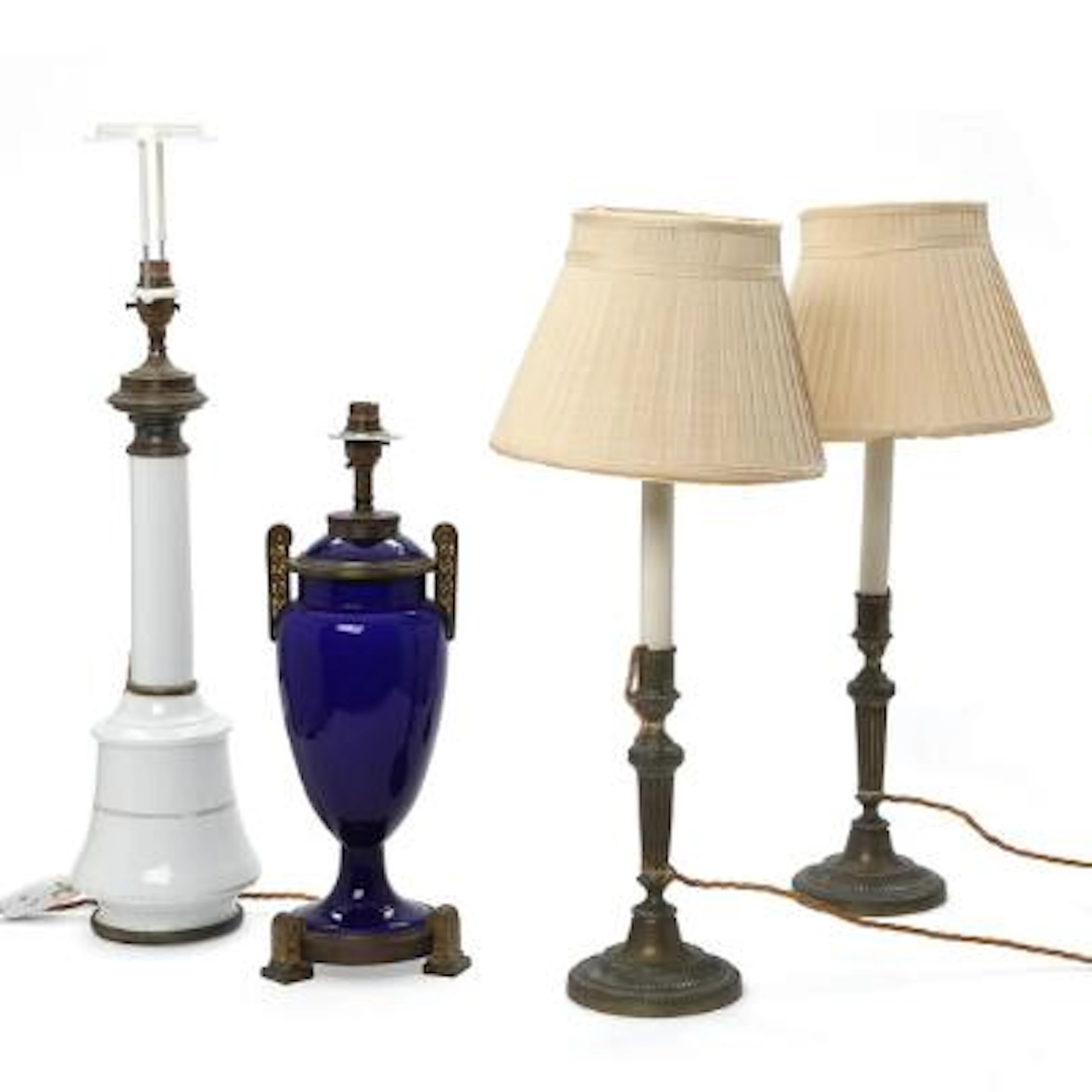 Two French porcelain table lamps and a pair of brass table lamps.
