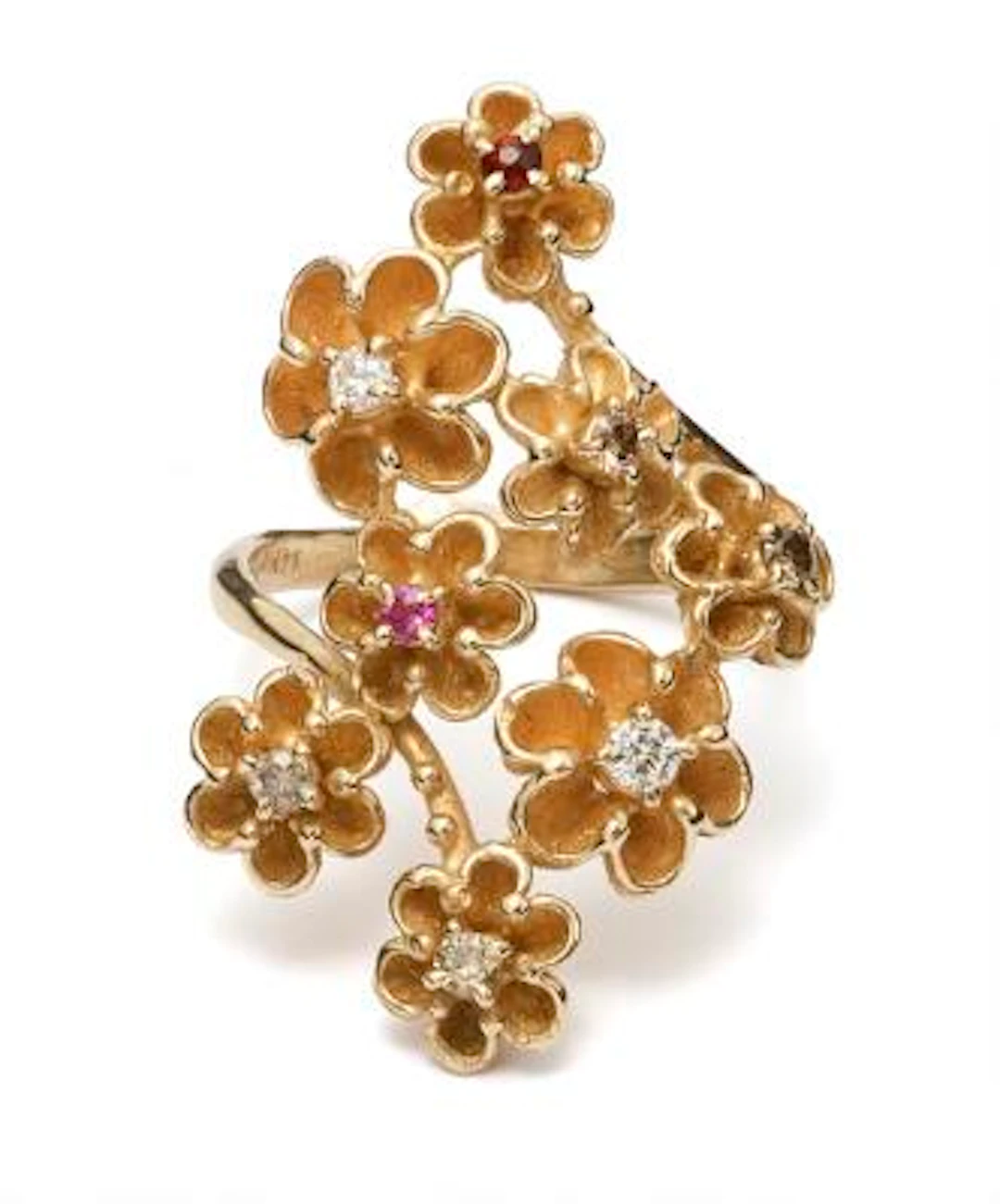 A diamond, sapphire- and a quartz ring set with numerous diamonds