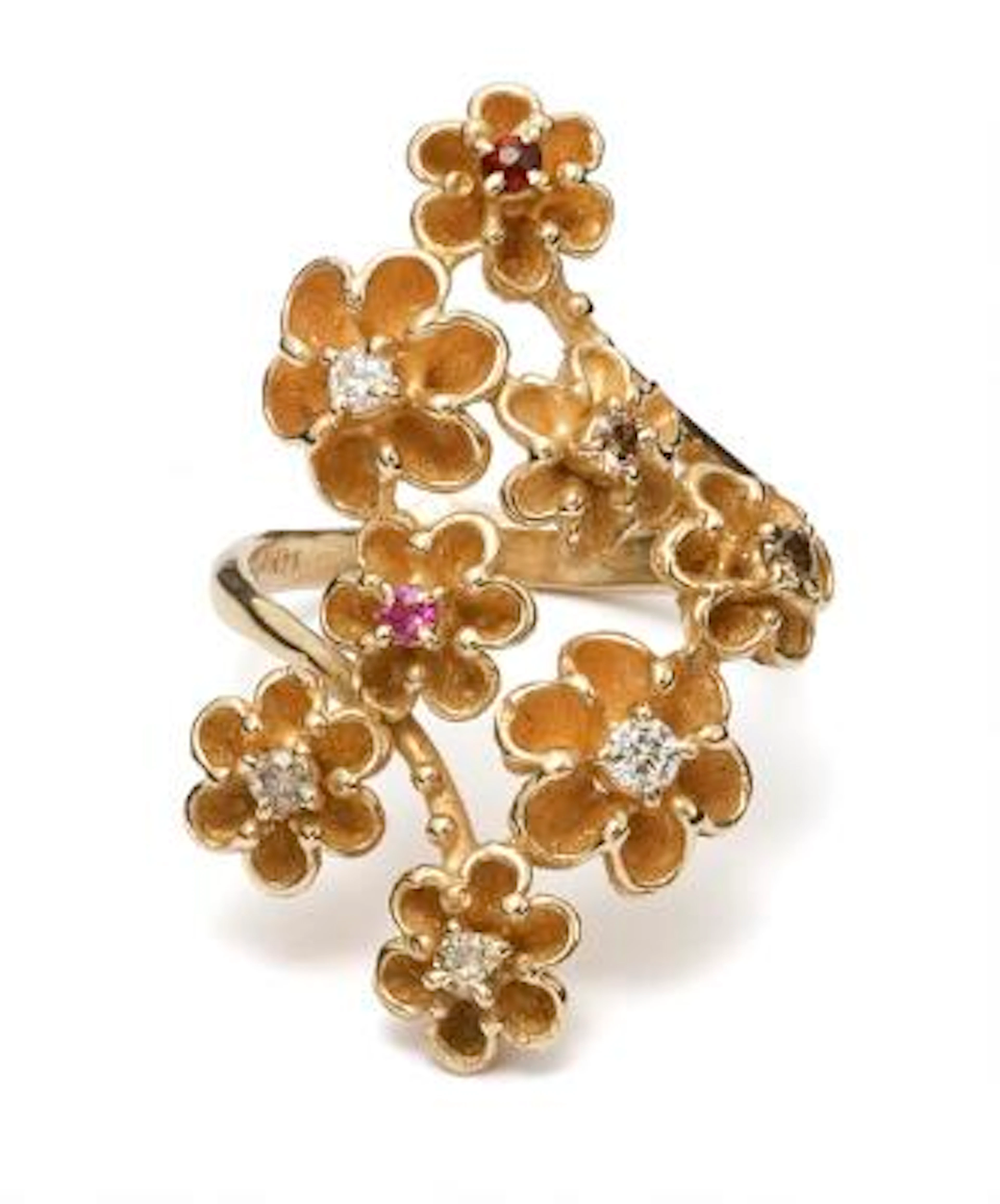 A diamond, sapphire- and a quartz ring set with numerous diamonds