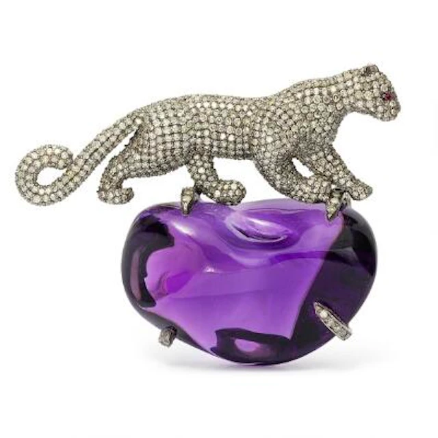 An amethyst and diamond brooch in the shape of a panther, mounted