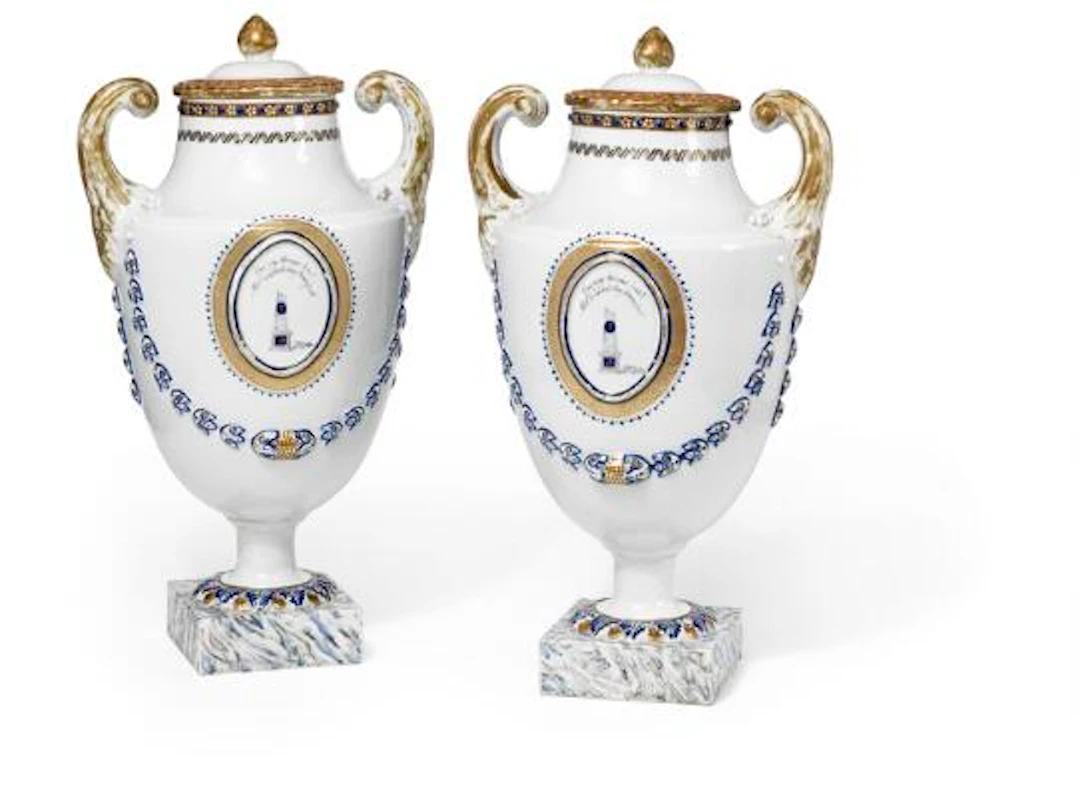 A pair of Chinese urn-shaped export porcelain vases on foursided bases.