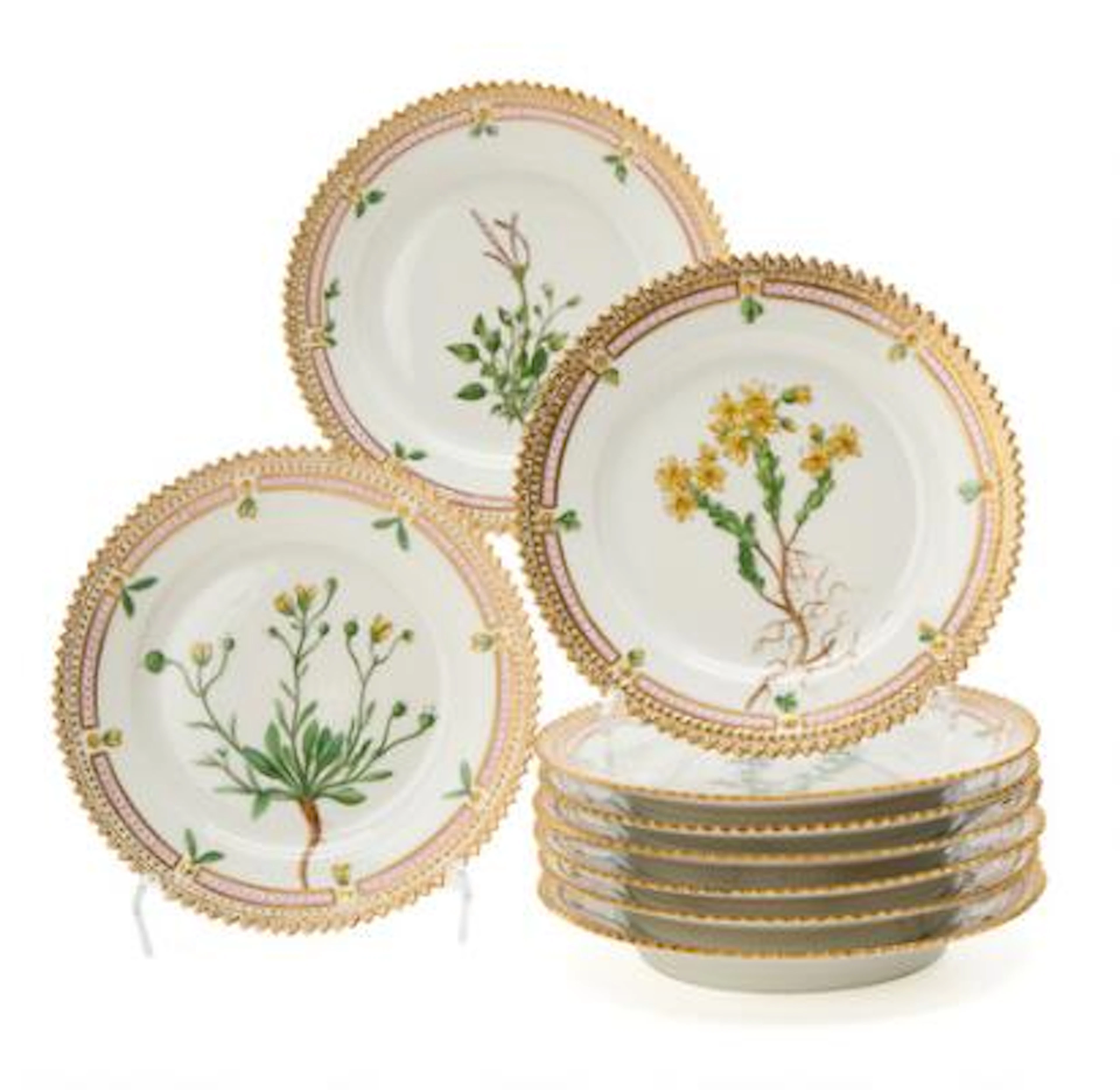 Nine "Flora Danica" enamelled and gilt bread & butter plates. Royal