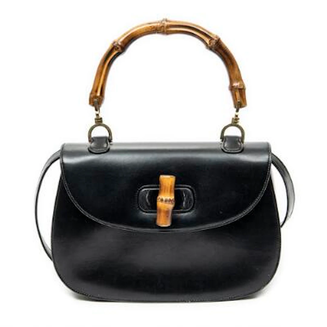 Gucci: A "Medium Bamboo Top Handle Flap" bag in black leather with