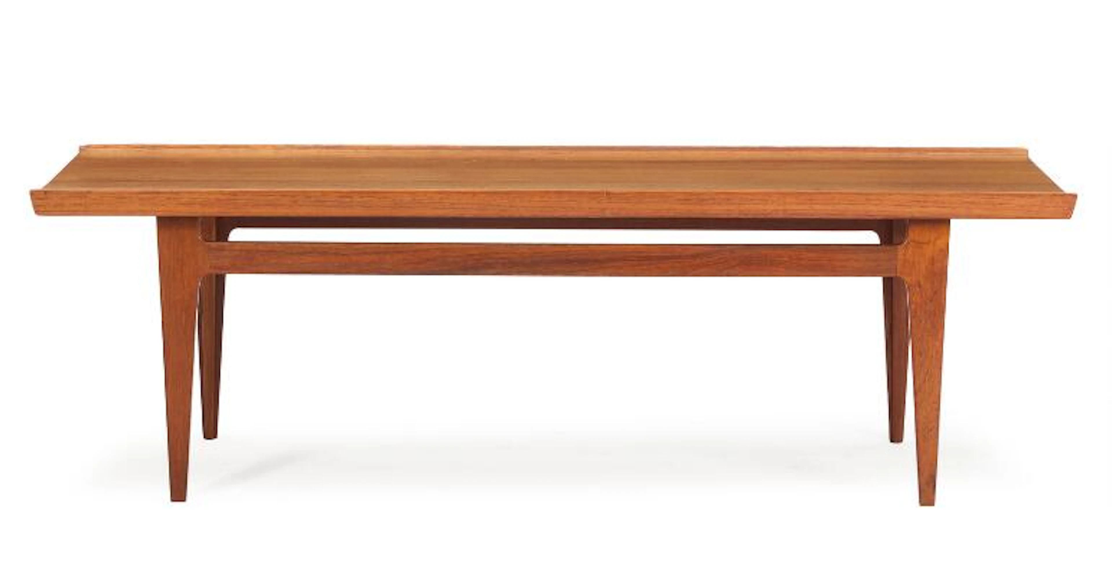 Finn Juhl: Rectangular solid teak coffee table. Manufactured by France