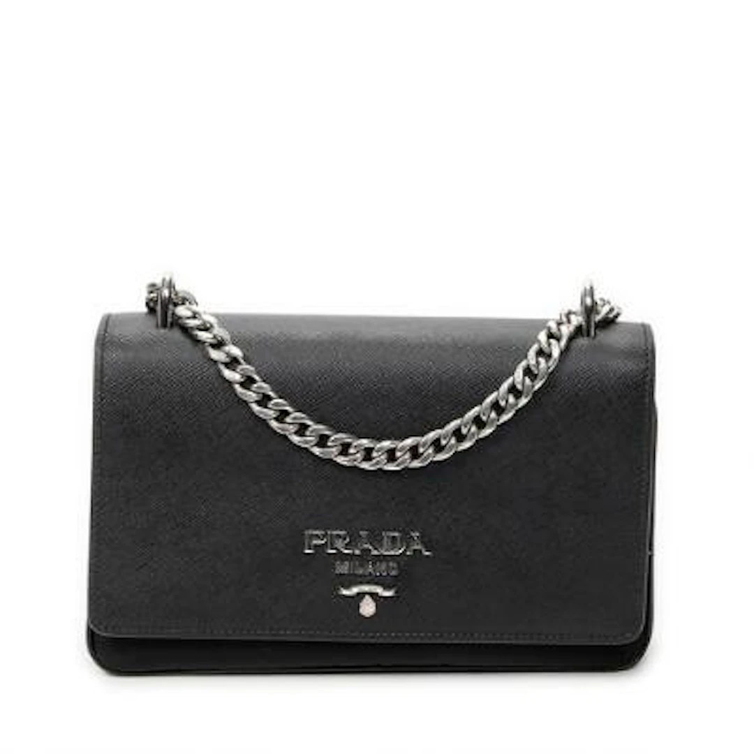 Prada: A "Chain Flap Crossbody" bag in partly black canvas and nylon