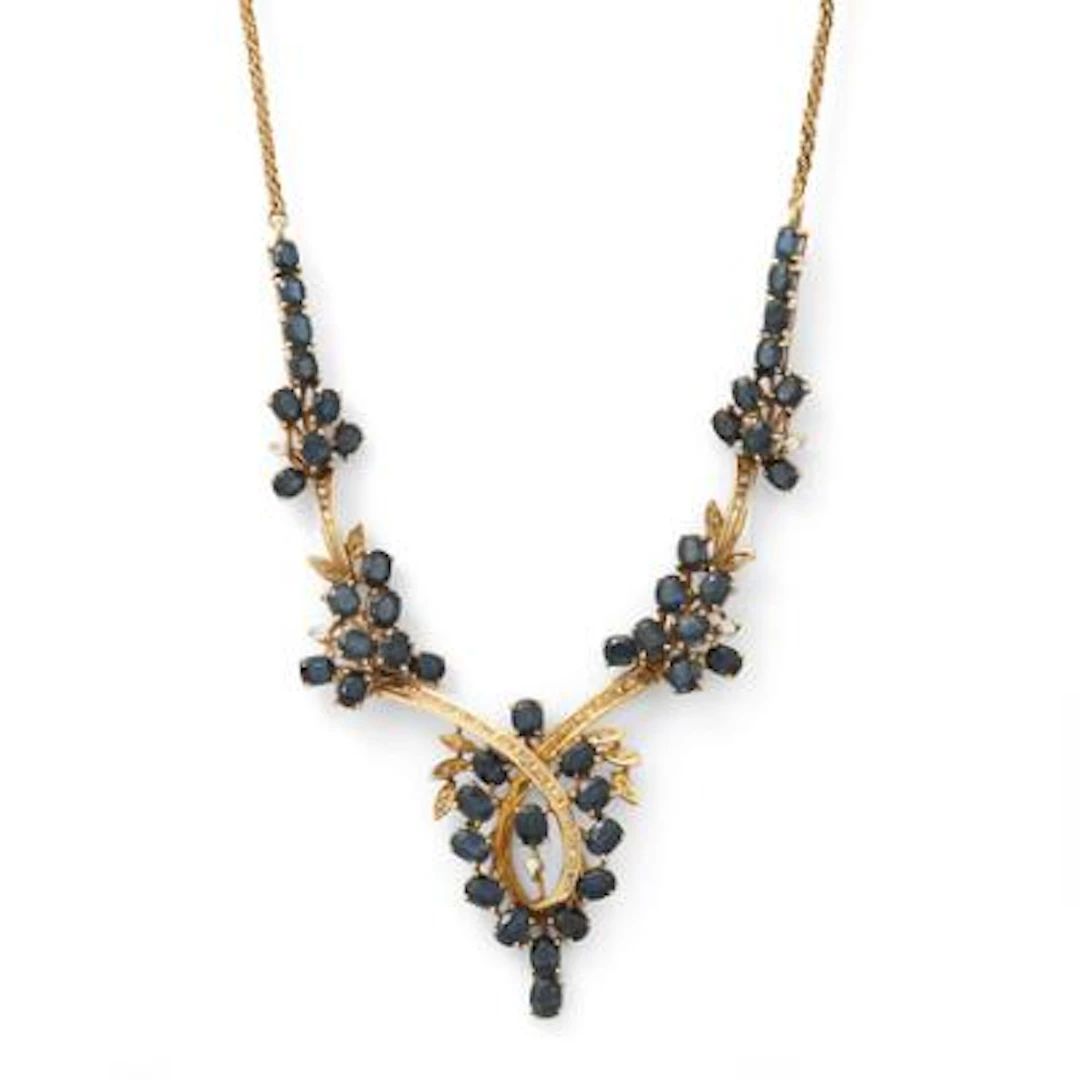 A sapphire and diamond necklace set with numerous sapphires and diamonds
