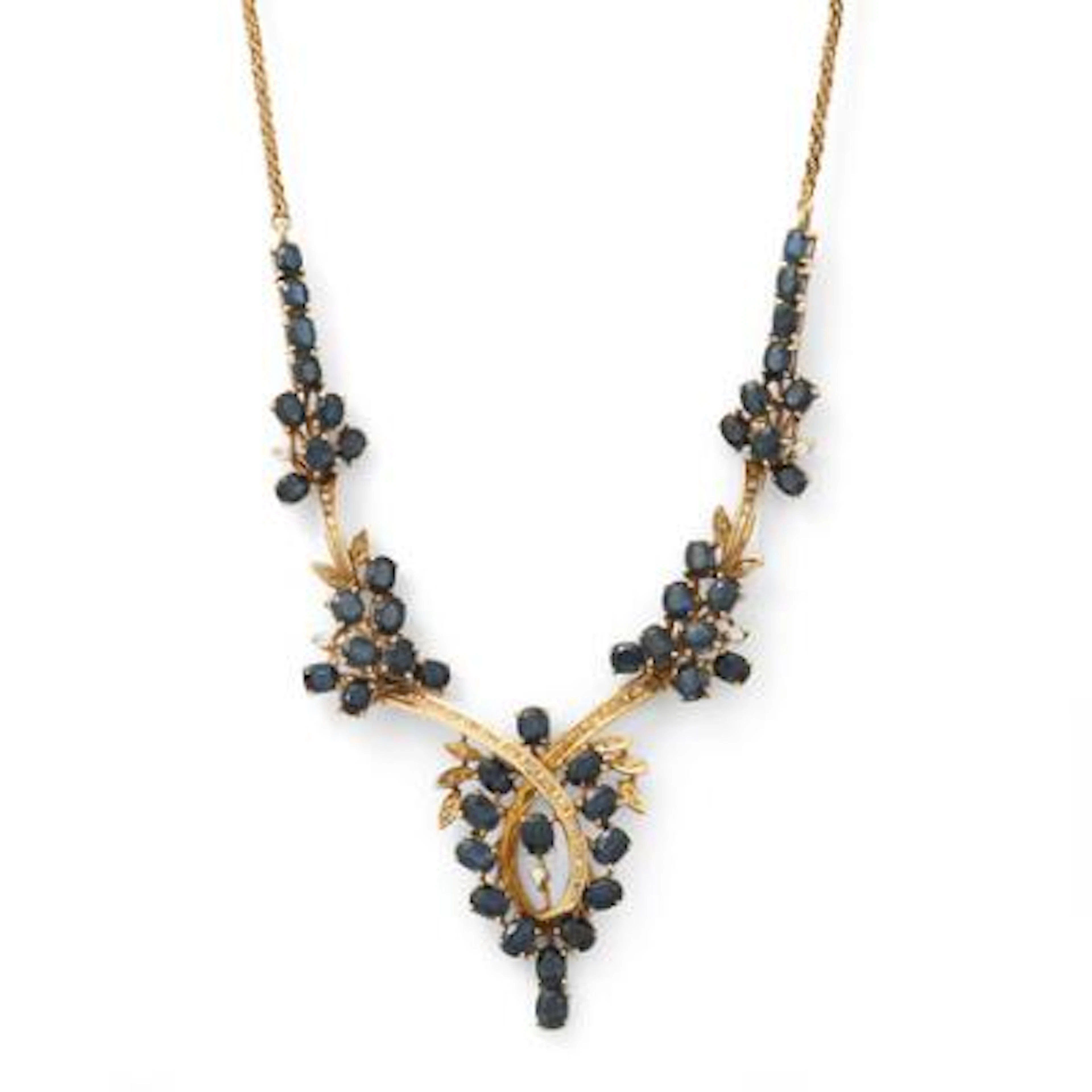 A sapphire and diamond necklace set with numerous sapphires and diamonds