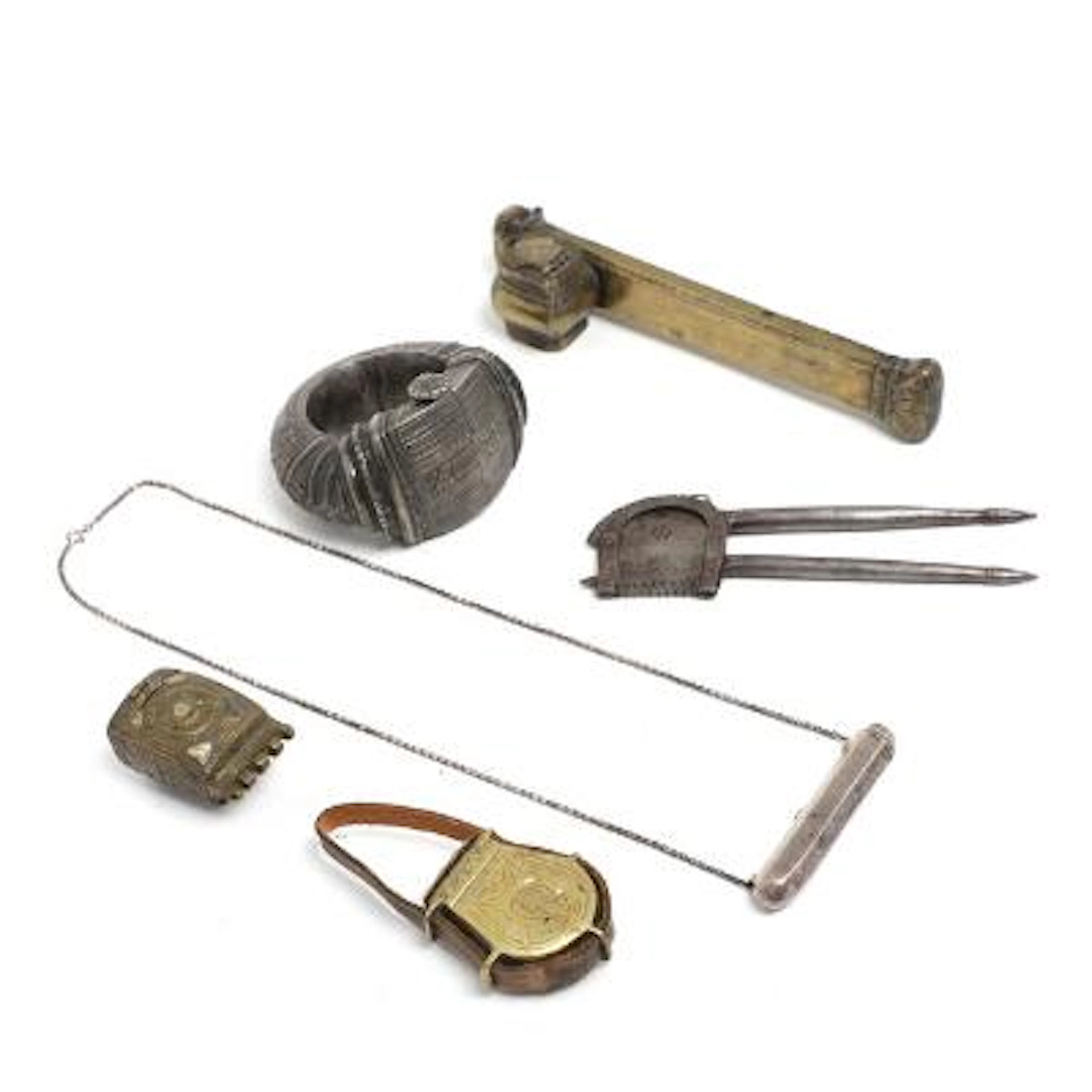 A collection of Middle Eastern and African utensils made of brass