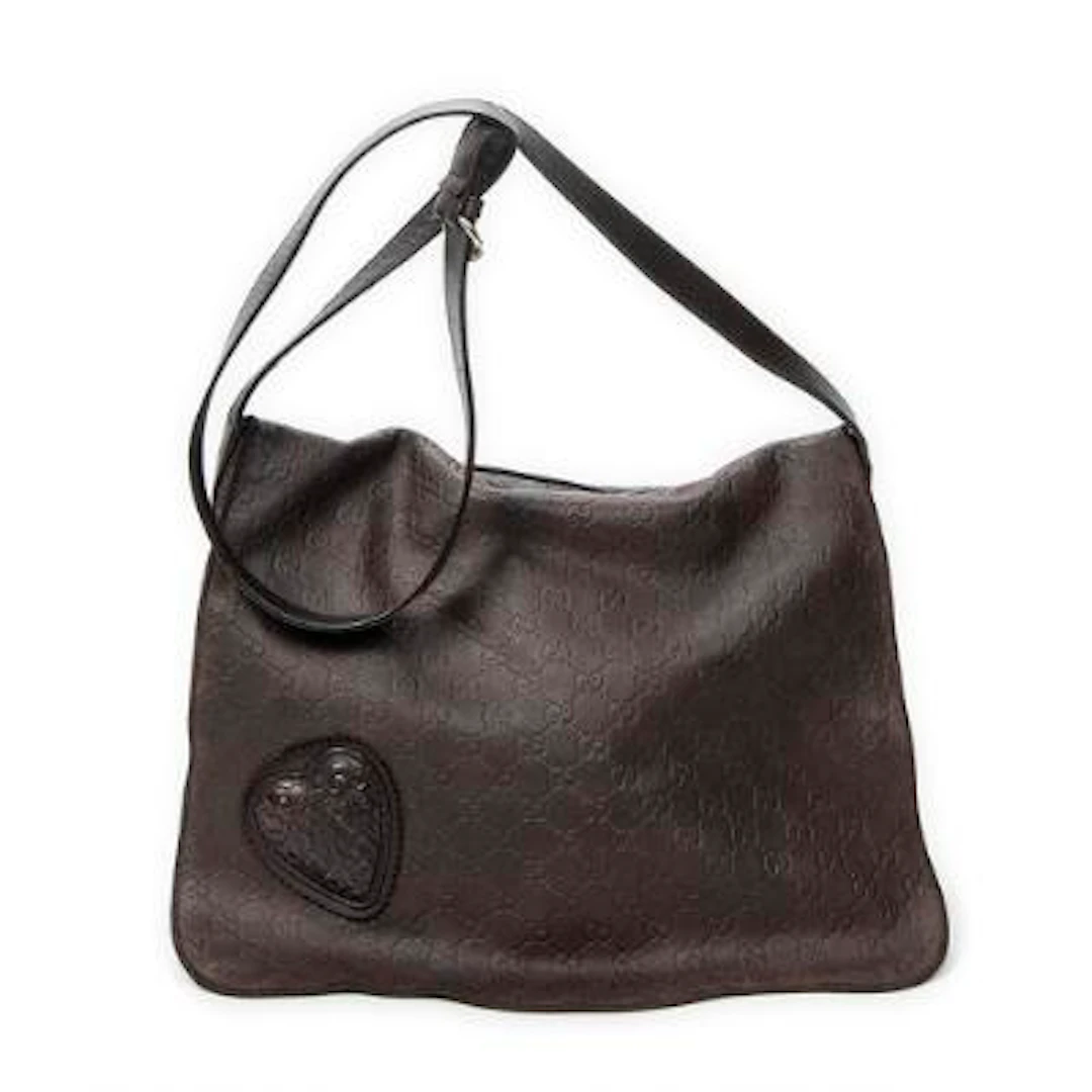 Gucci: A "Large Tribeca Messenger" bag in dark brown Guccissima leather