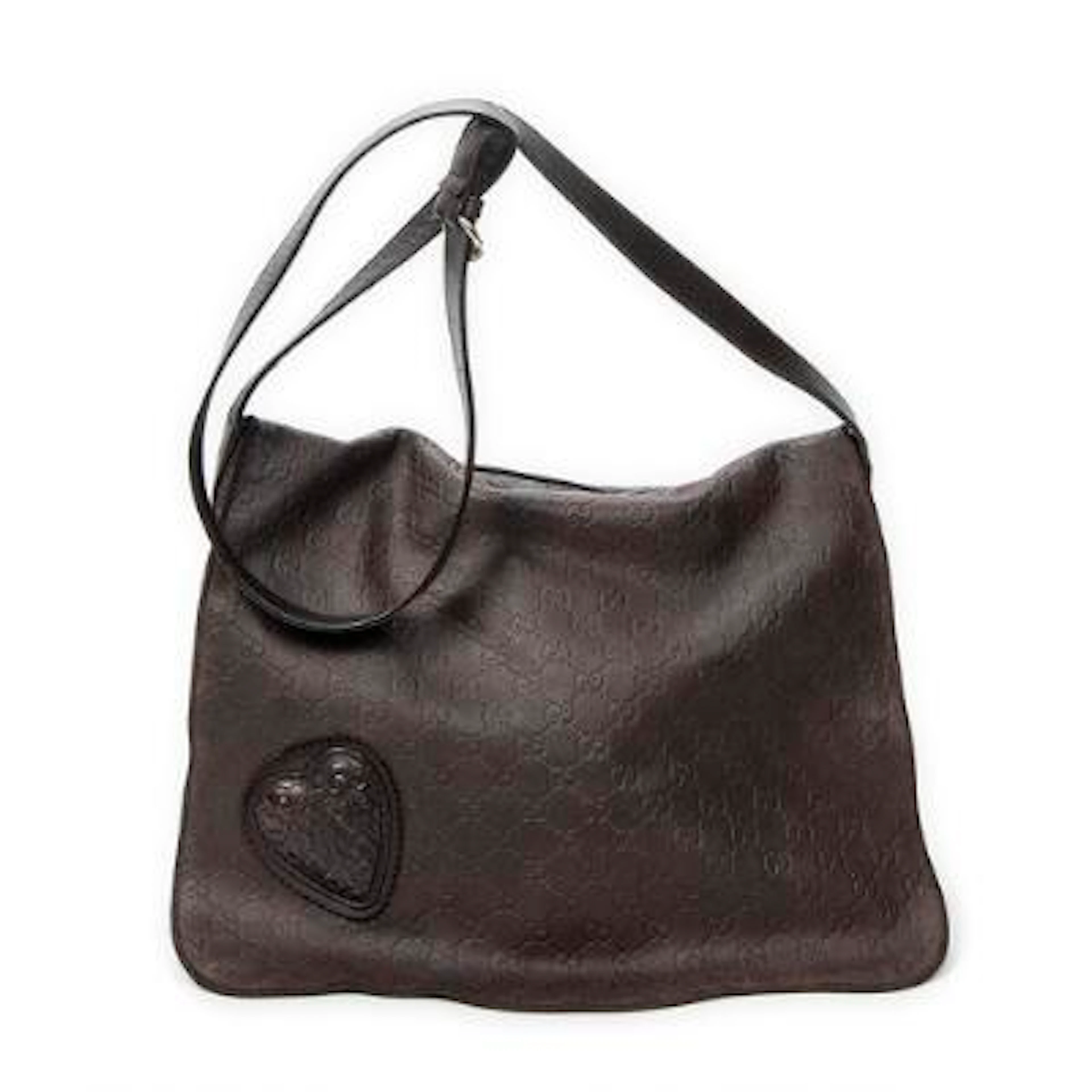 Gucci: A "Large Tribeca Messenger" bag in dark brown Guccissima leather
