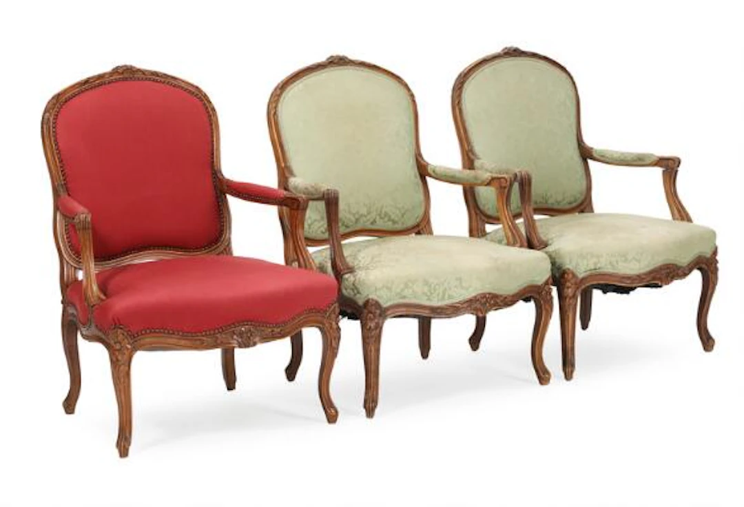 Set of thee walnut armchairs. Rococo style. Late 19th century. (3)