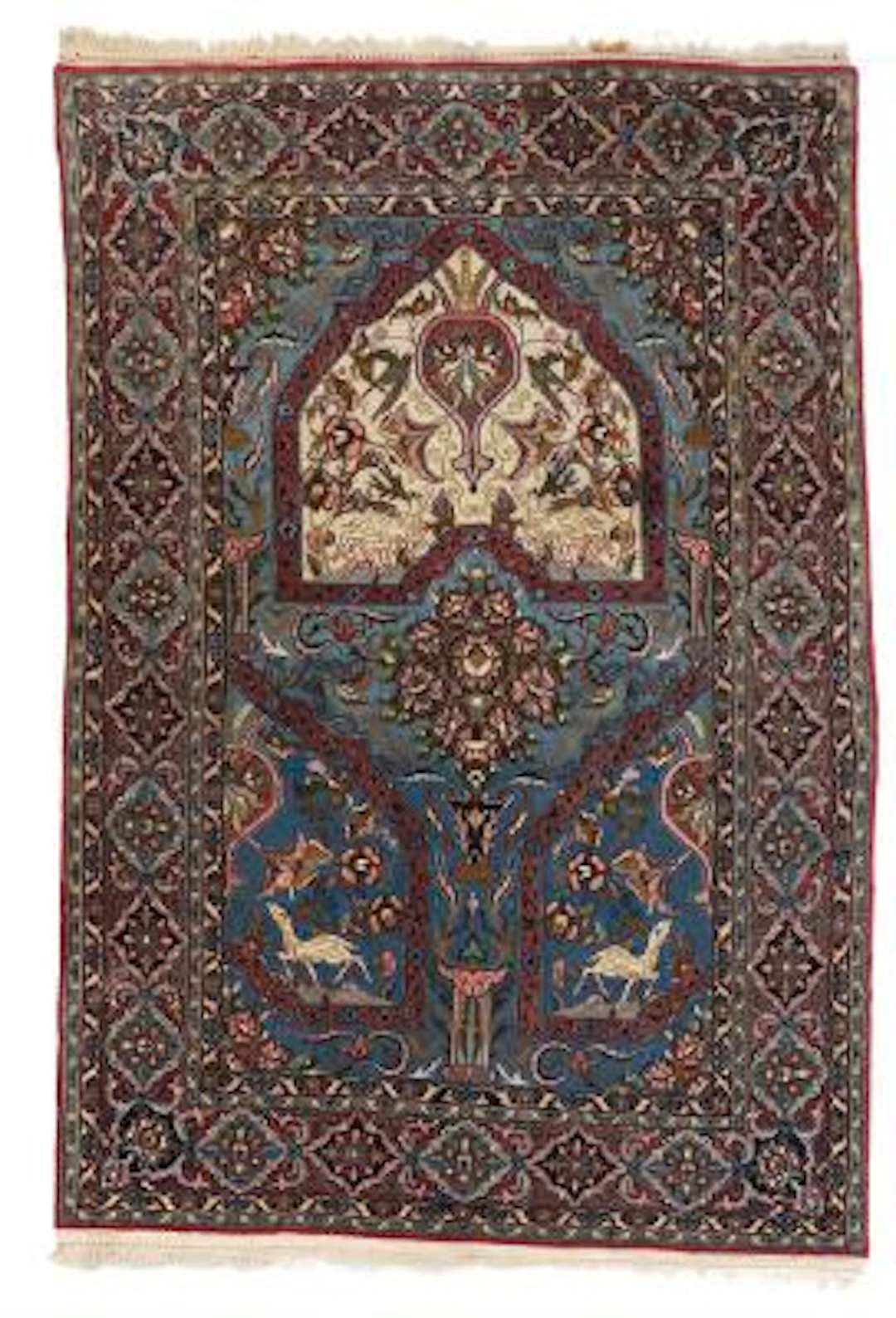 A Isfahan rug, Persia. Arch design with flower vase and animal motifs.