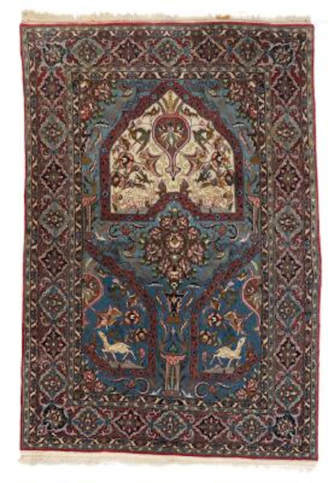 A Isfahan rug, Persia. Arch design with flower vase and animal motifs.