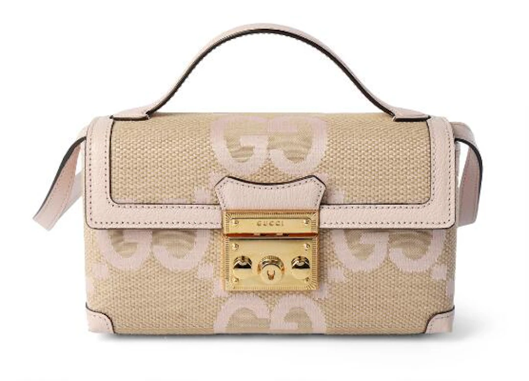 Gucci: A "Jumbo GG Top Handle Bag" of beige and light pink canvas