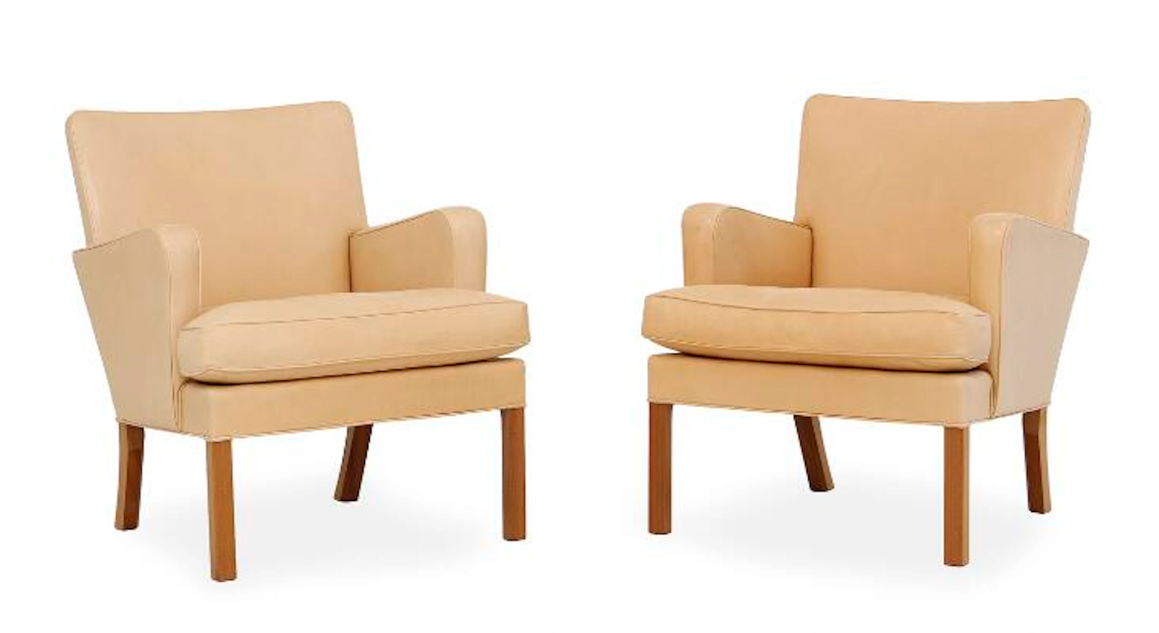 Kaare Klint: A pair of easy chairs with oak legs. Sides, back and
