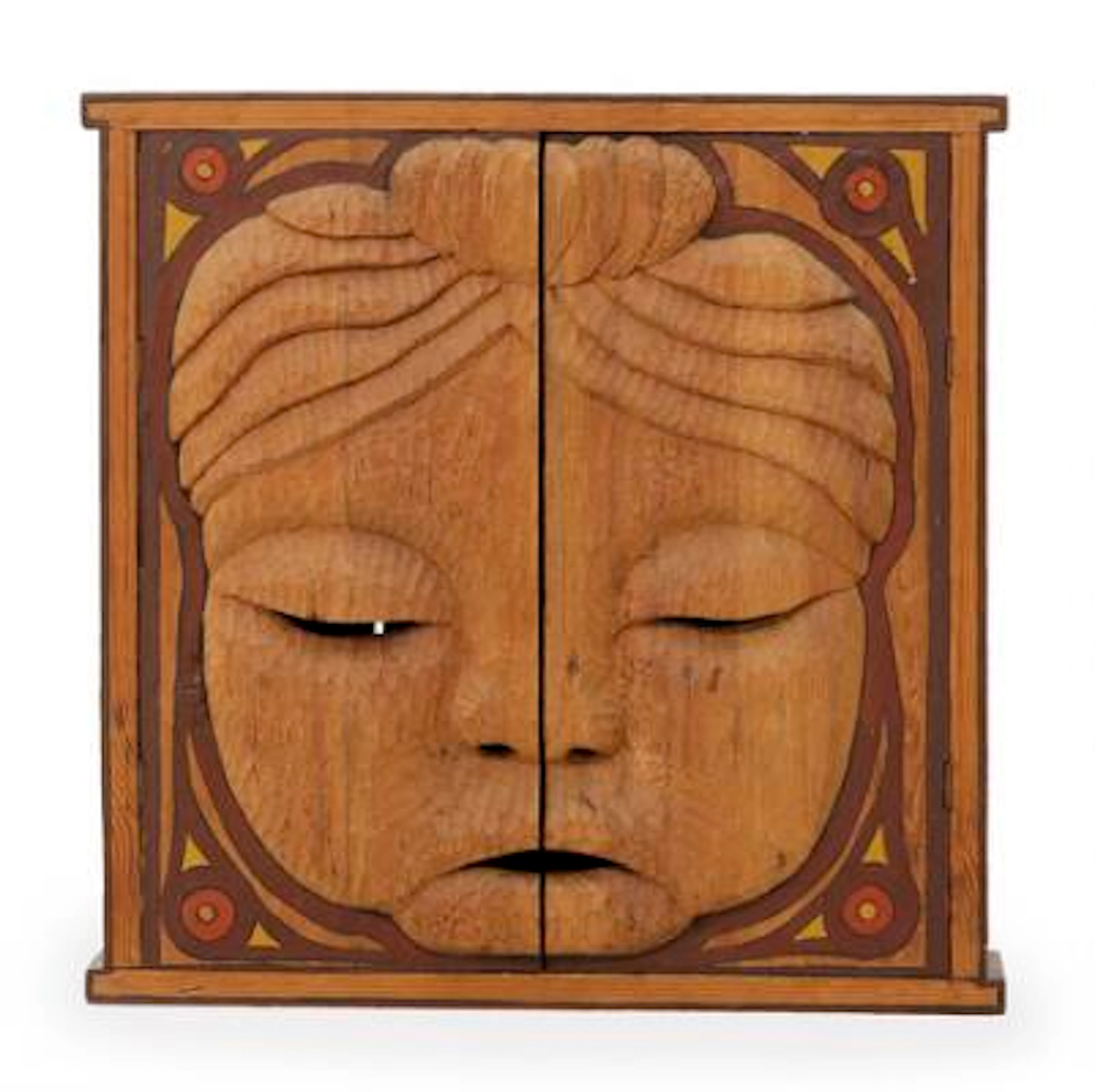 Unknown design: Cabinet with face-like carved details and partially