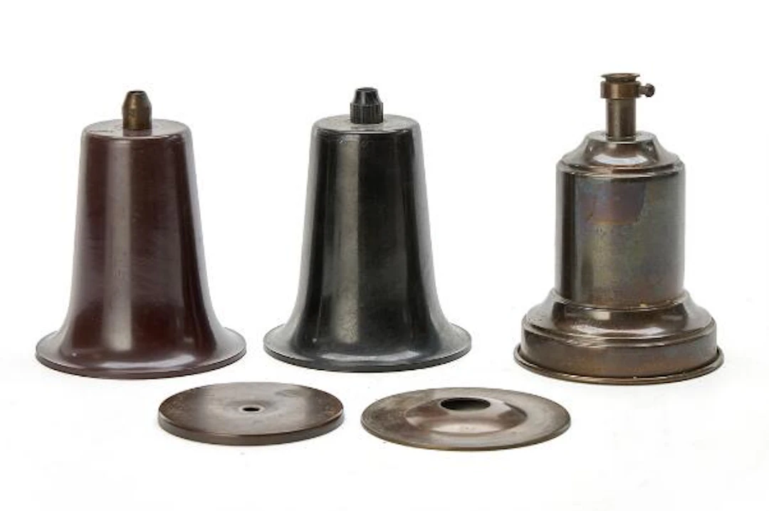 Poul Henningsen: Spare parts in patinated brass and bakelite. (5)