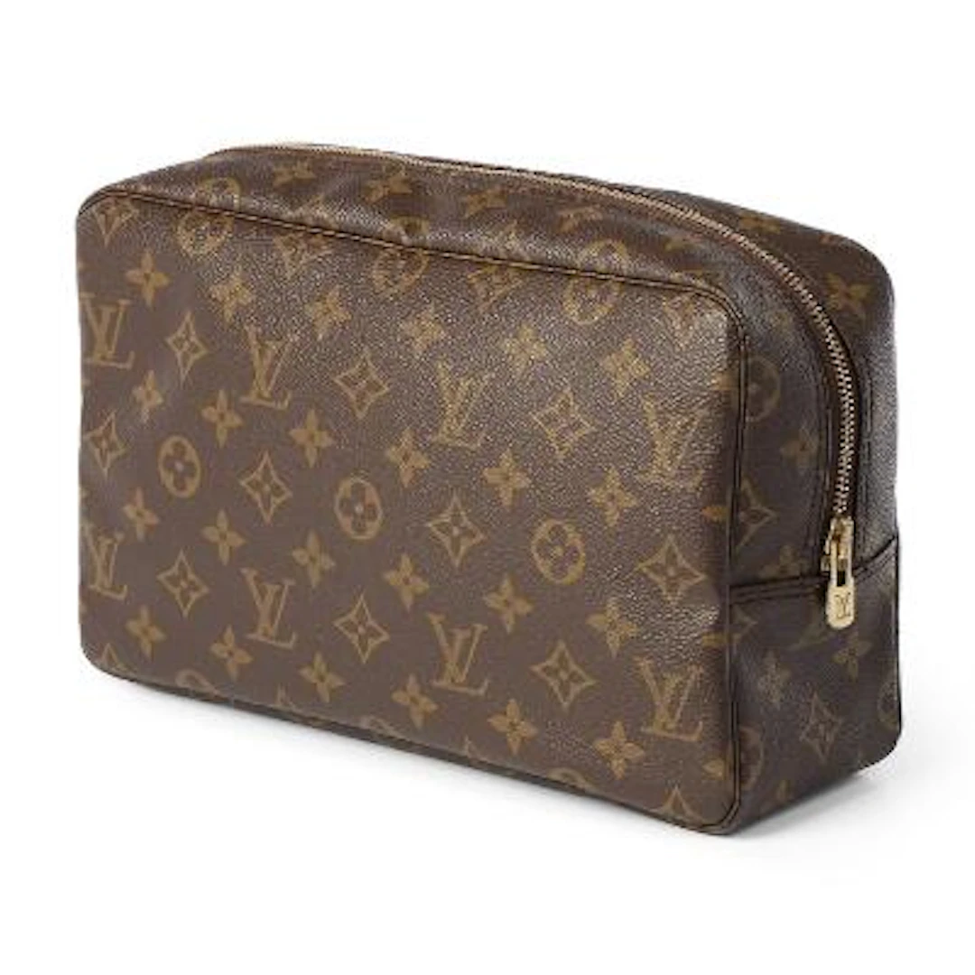 Louis Vuitton: A "Trousse Toilette 28" of brown monogram canvas with