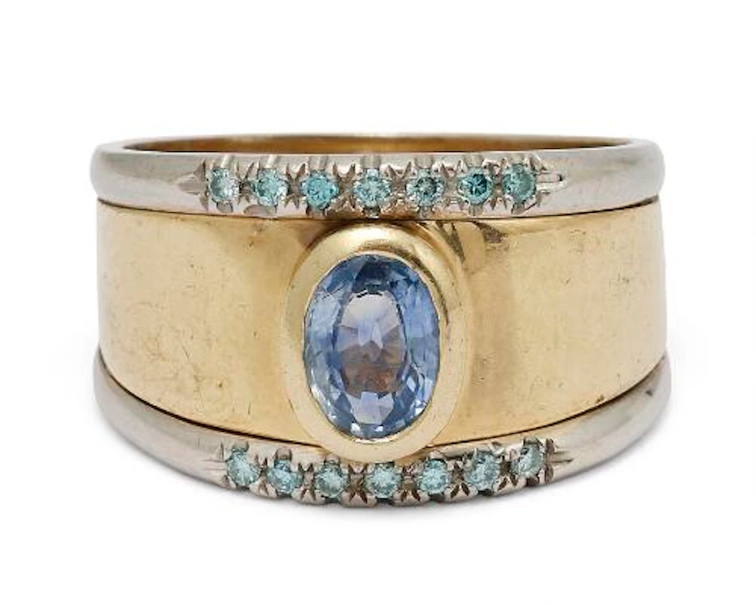 A sapphire and diamond ring set with a sapphire and diamonds, mounted