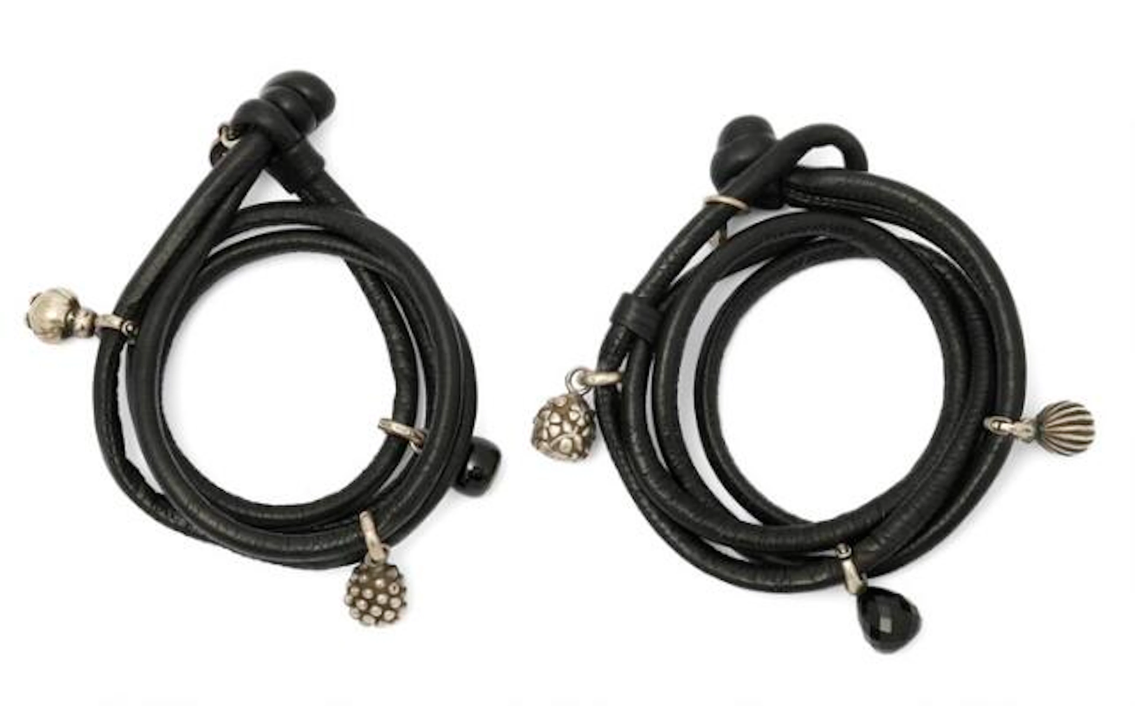 Ole Lynggaard: Two leather bracelets each set with three charms, two