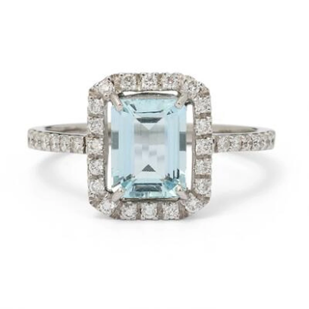 An aquamarine and diamond ring set with an aquamarine and diamonds