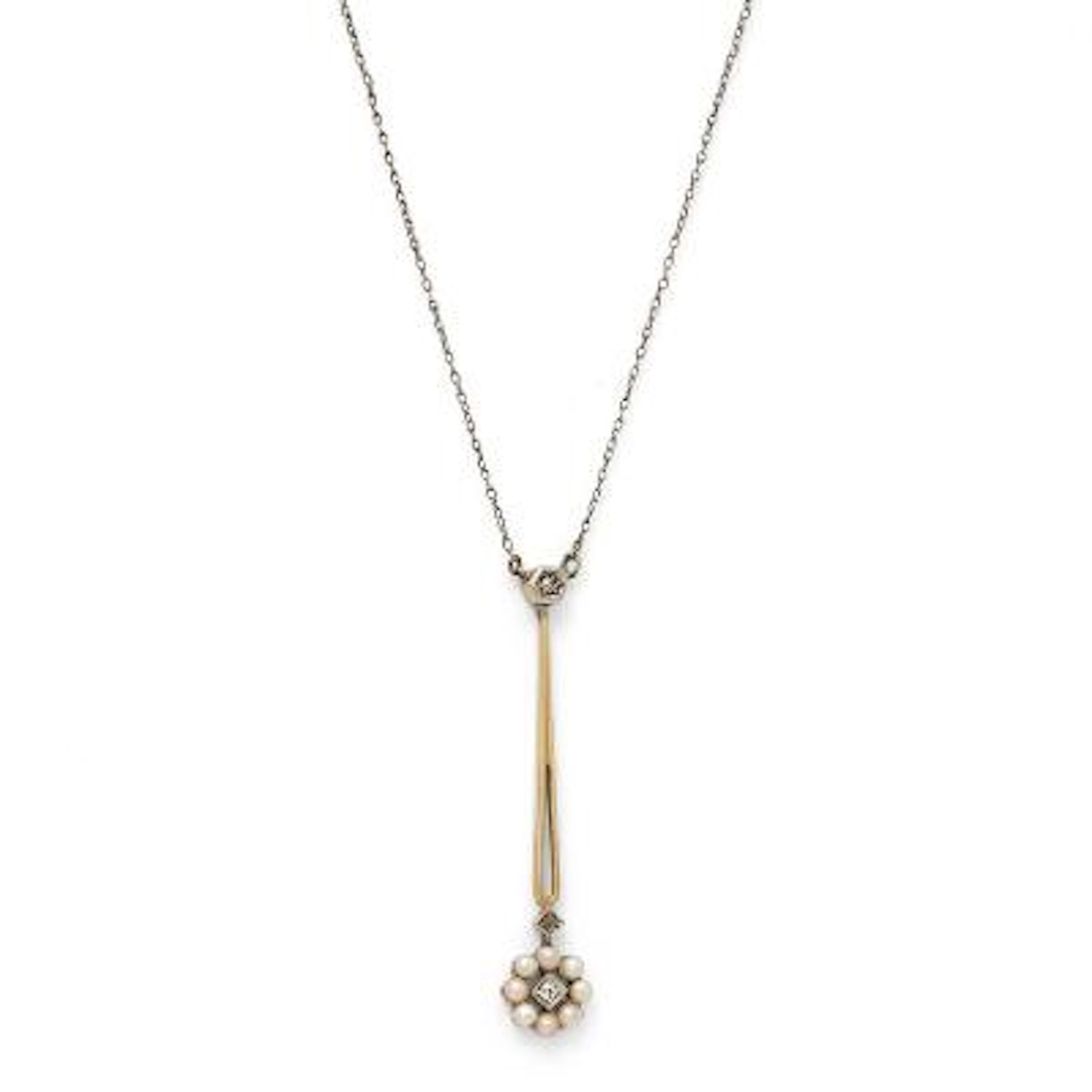 A silver necklace set with a pearl and diamond pendant with pearls