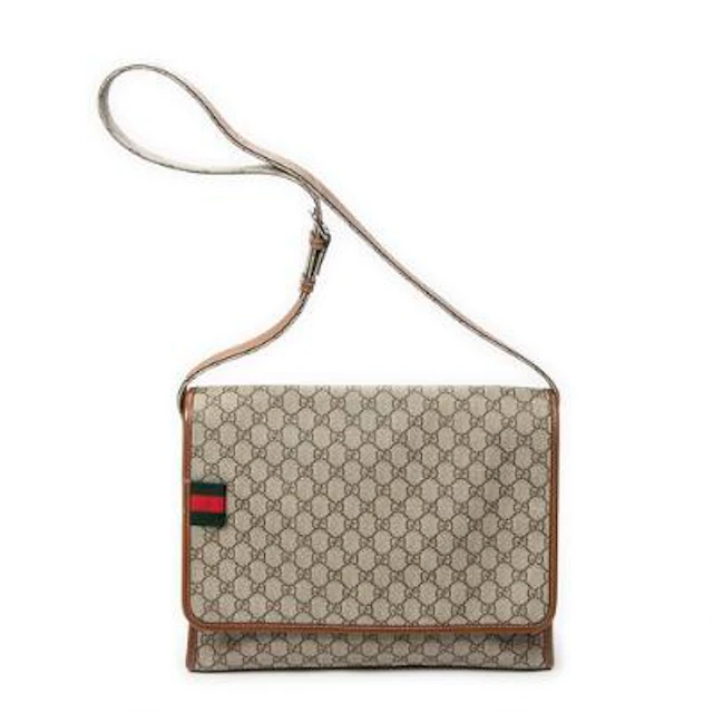 Gucci: A messenger bag of brown monogram coated canvas with brown