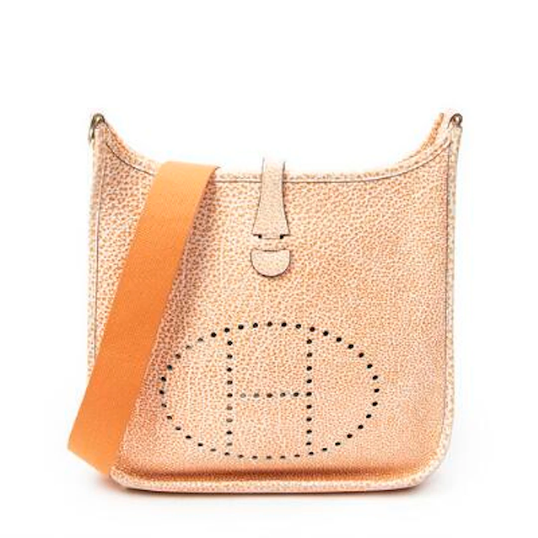 Hermès: An "Evelyne I PM" bag of orange/white Dalmatian Buffalo-leather