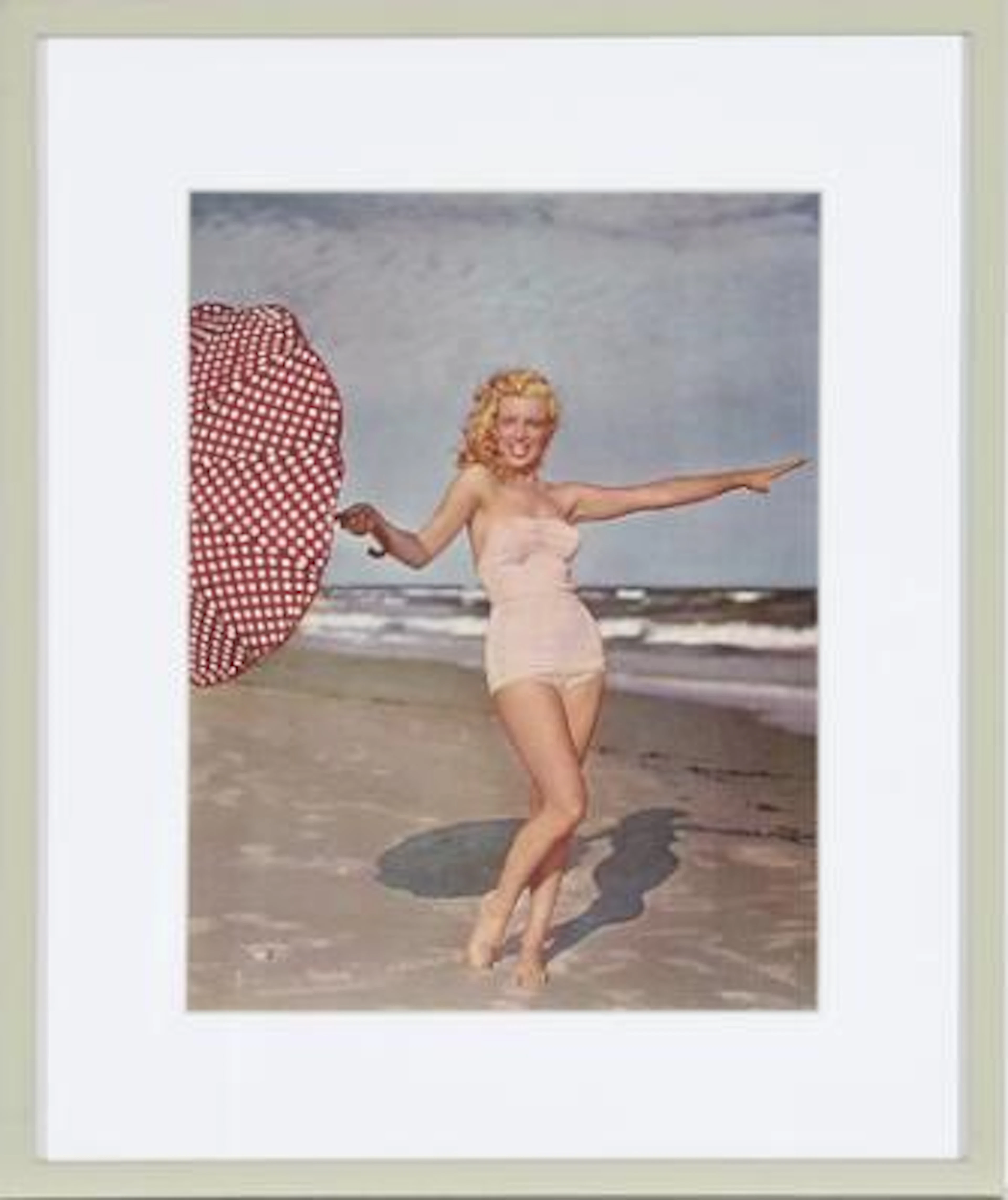 American actress Marilyn Monroe (1926–1962) posing with umbrella on