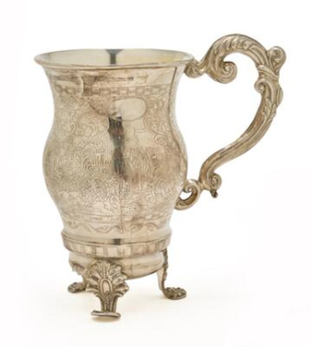 A Russian silver cup on three feet, gilt interior. Moscow, circa 1850.