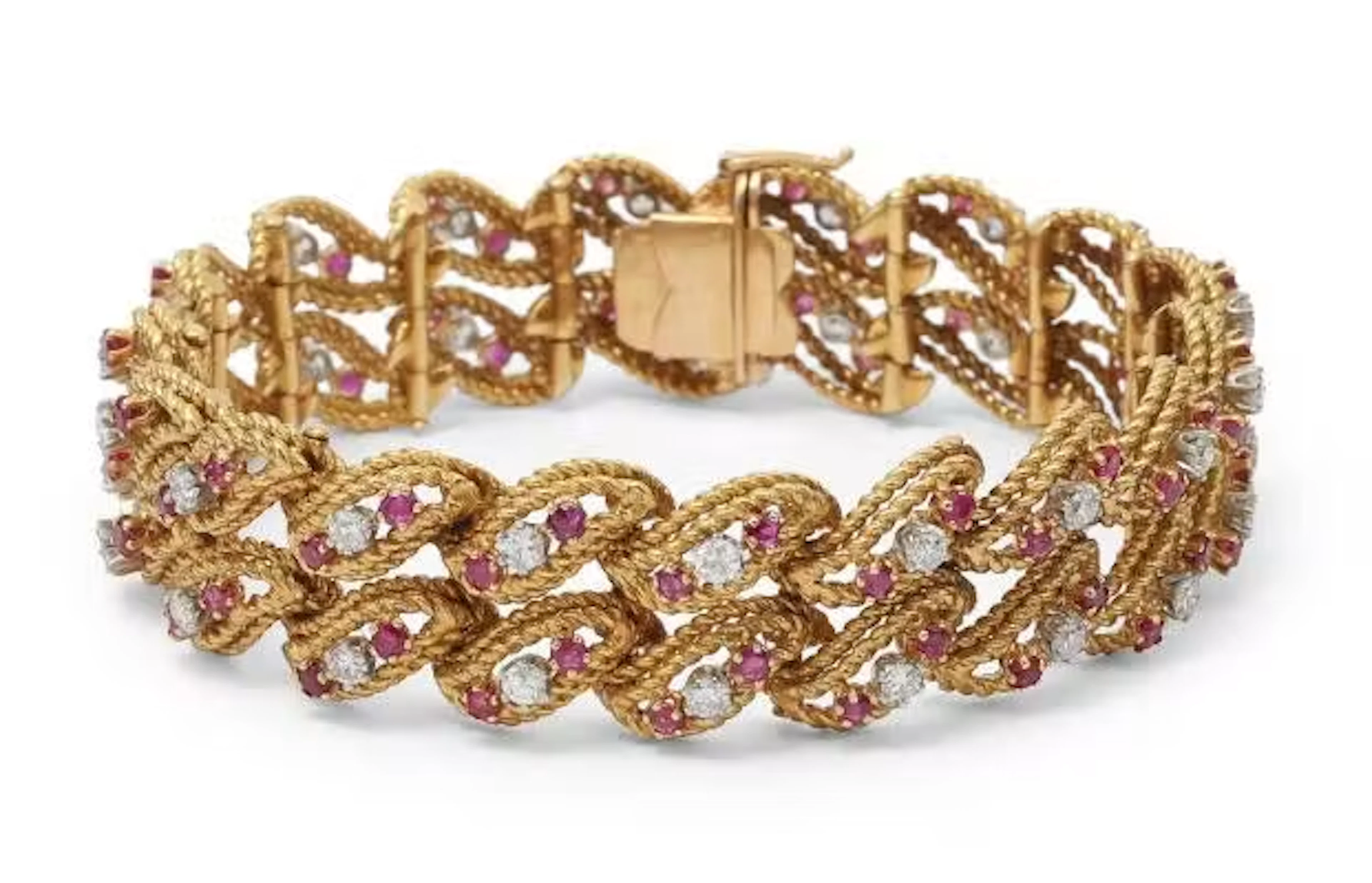 A sapphire and diamond bracelet set with numerous pink sapphires and
