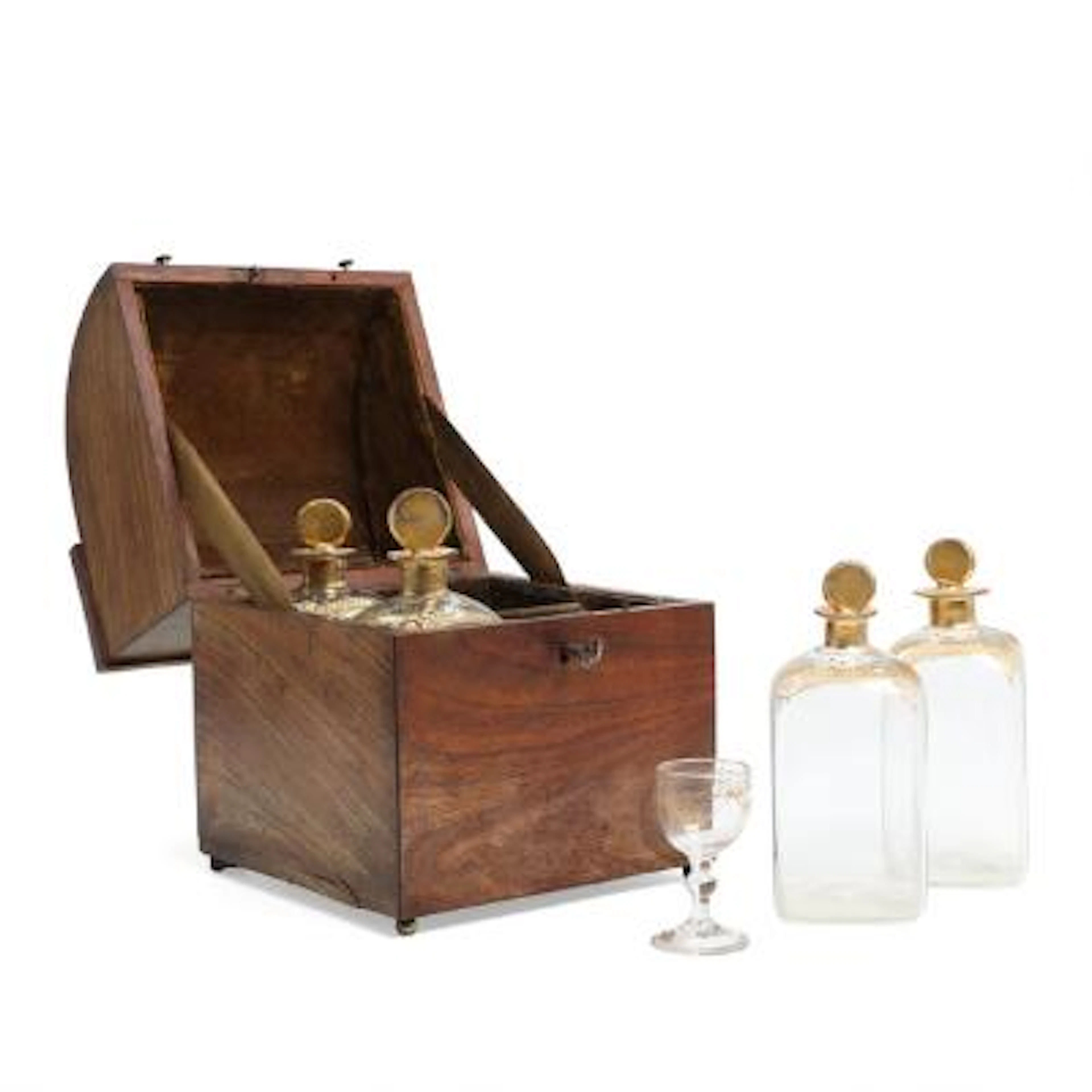 A 19th century mahogany cantina containing four carafes and a glass
