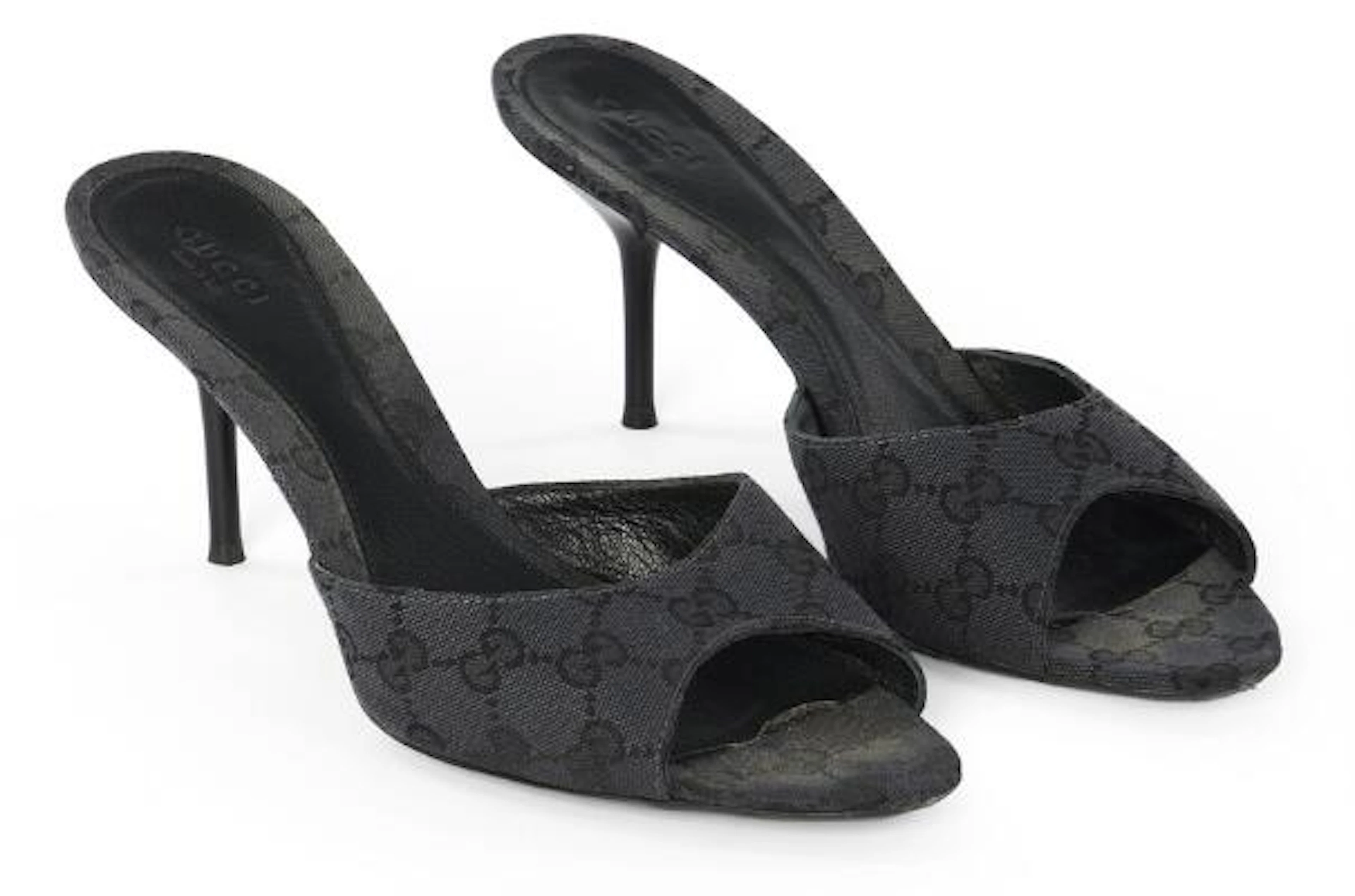 Gucci: A pair of stilettos of black monogram canvas. Heel height app.