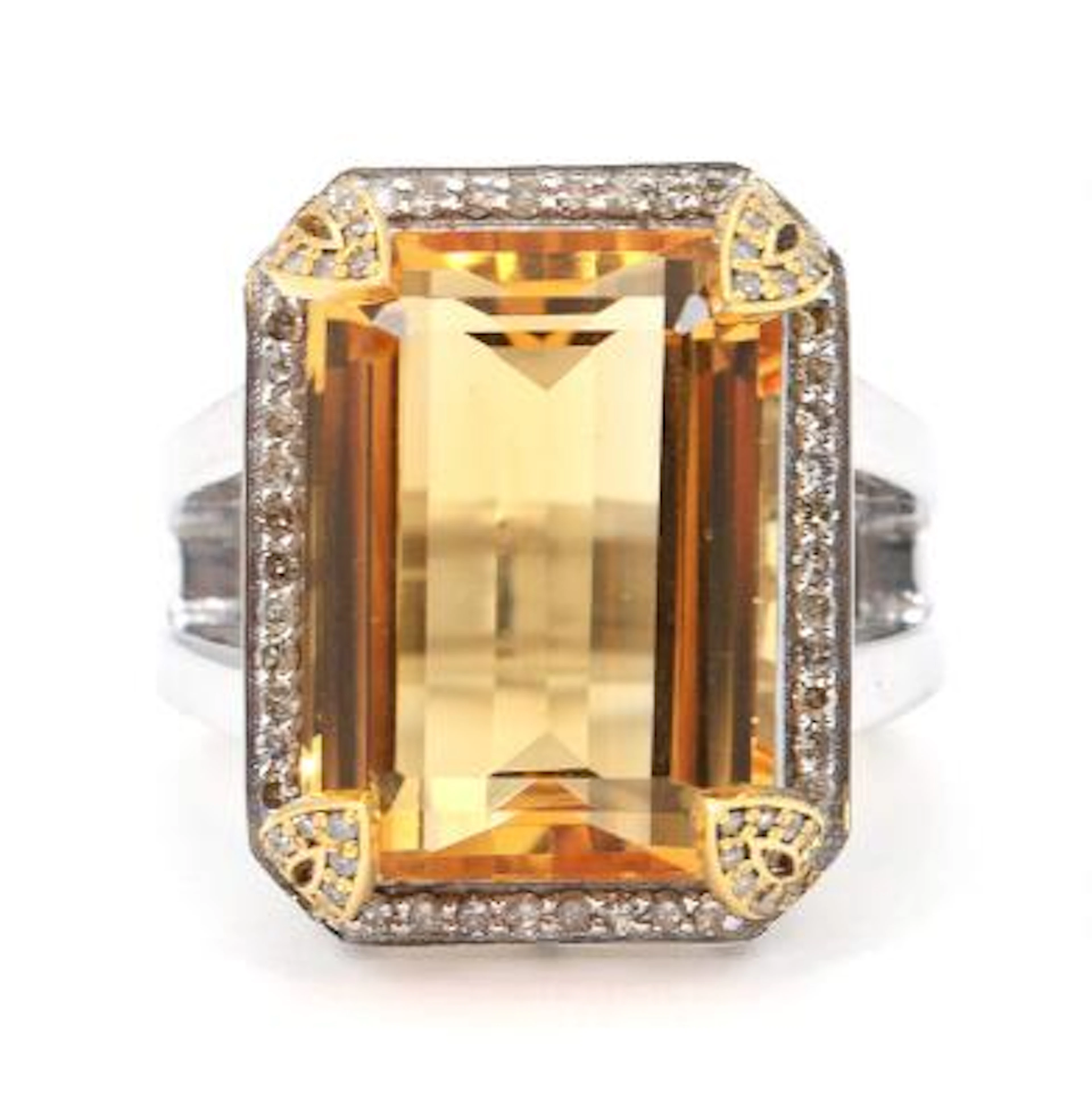 A citrine and diamond ring set with an emerald-cut citrine encircled