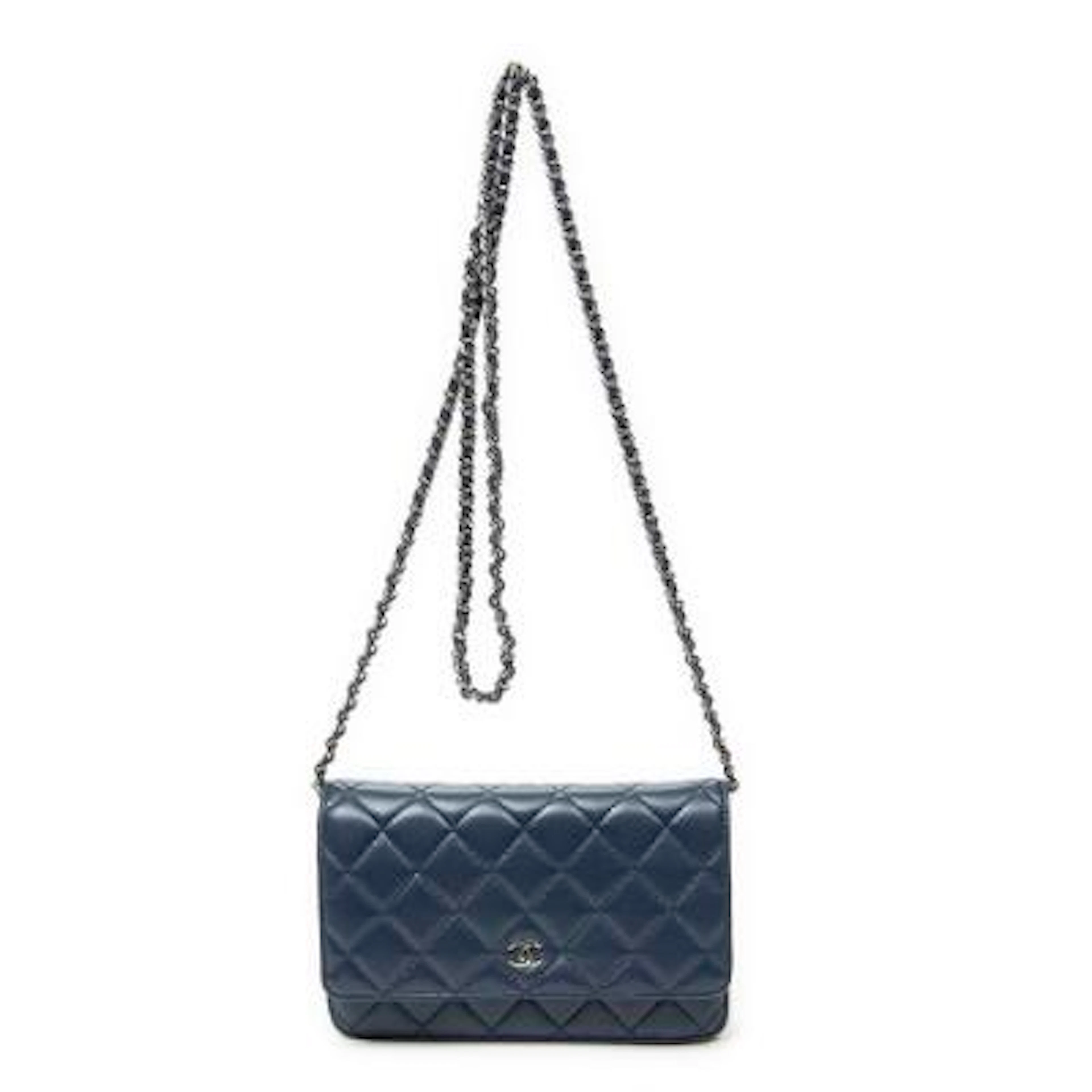 Chanel: A "Classic Wallet on Chain" in quilted dark blue leather with
