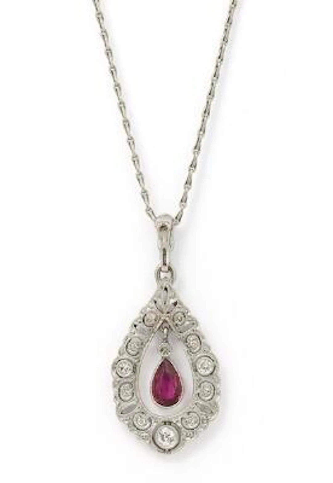 A ruby and diamond pendant set with a ruby and numerous diamonds