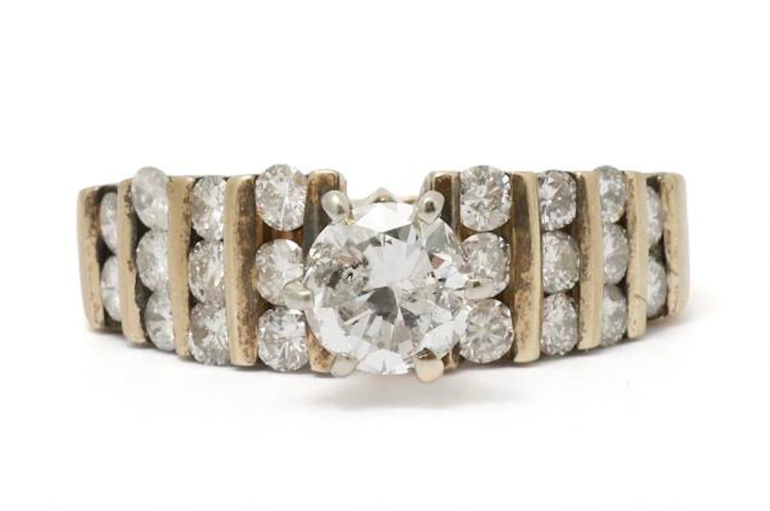 A diamond ring set with numerous brilliant-cut diamonds, mounted in