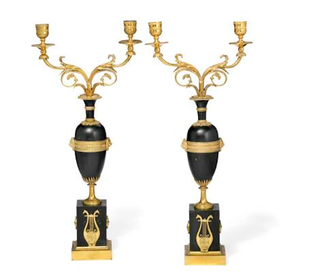 French workshop, first half-19th century: A pair of candelabra, gilt-patinated